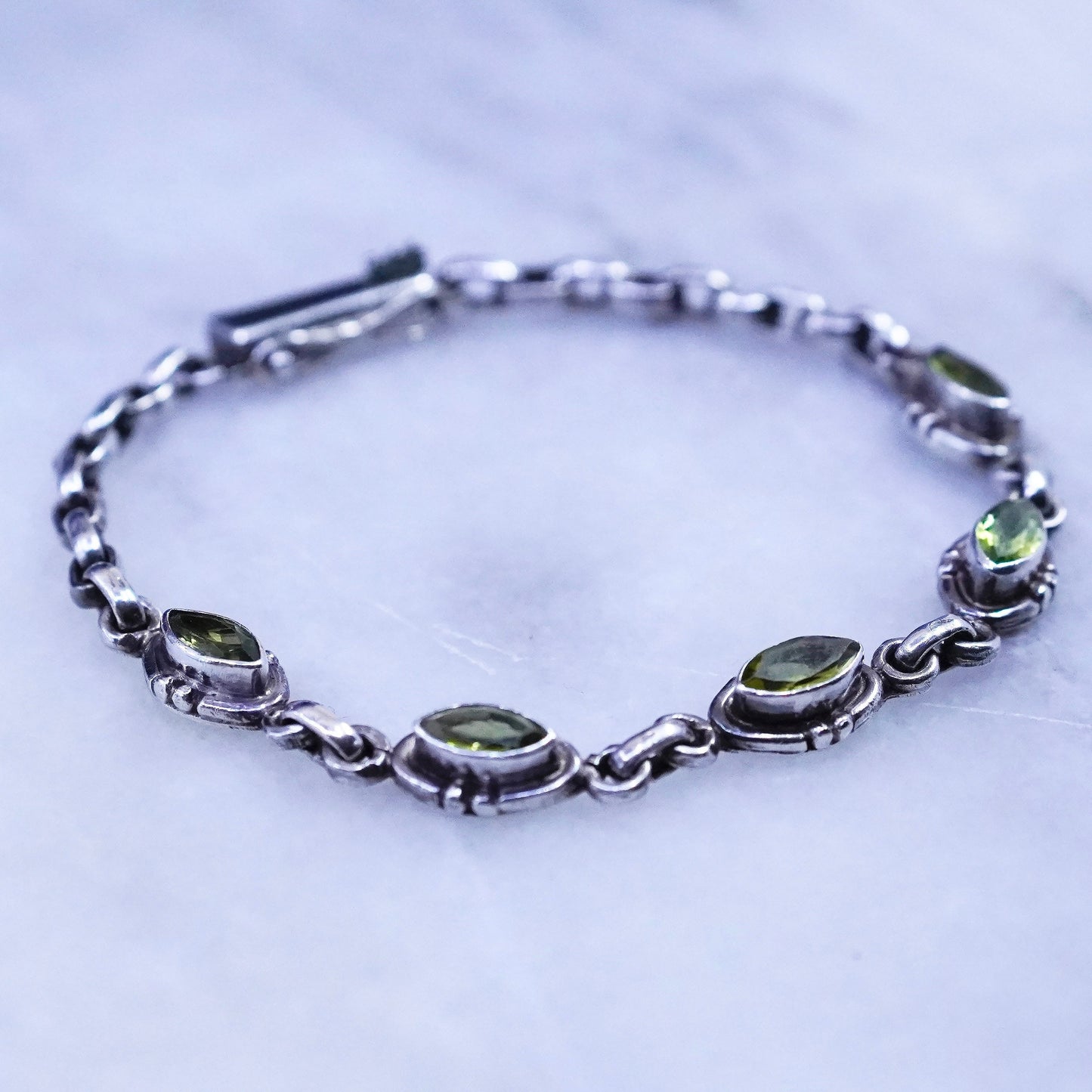 7”, vintage Sterling 925 silver tennis bracelet with marquise shaped peridot