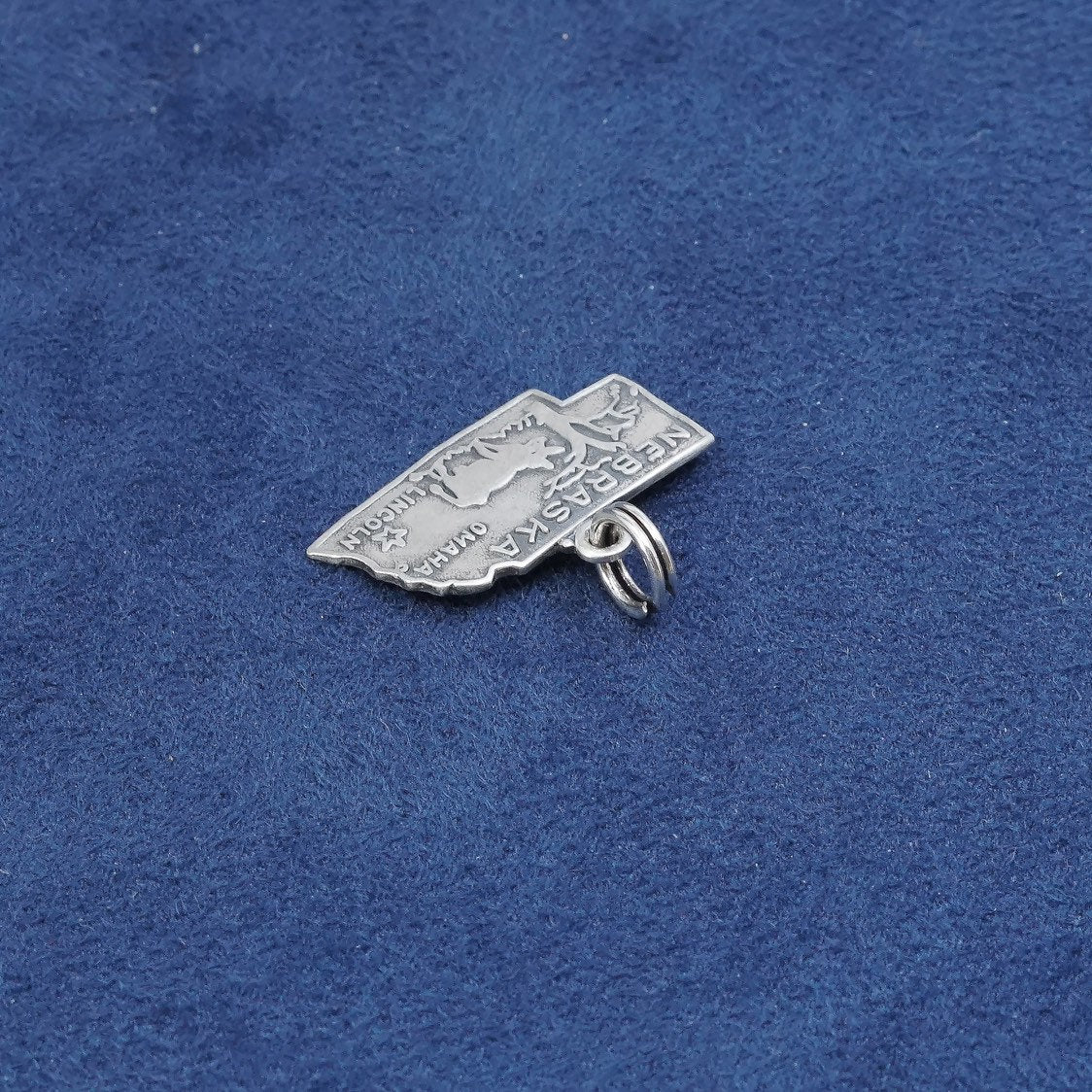 vtg sterling silver handmade pendant, 925 Nebraska state tag charm