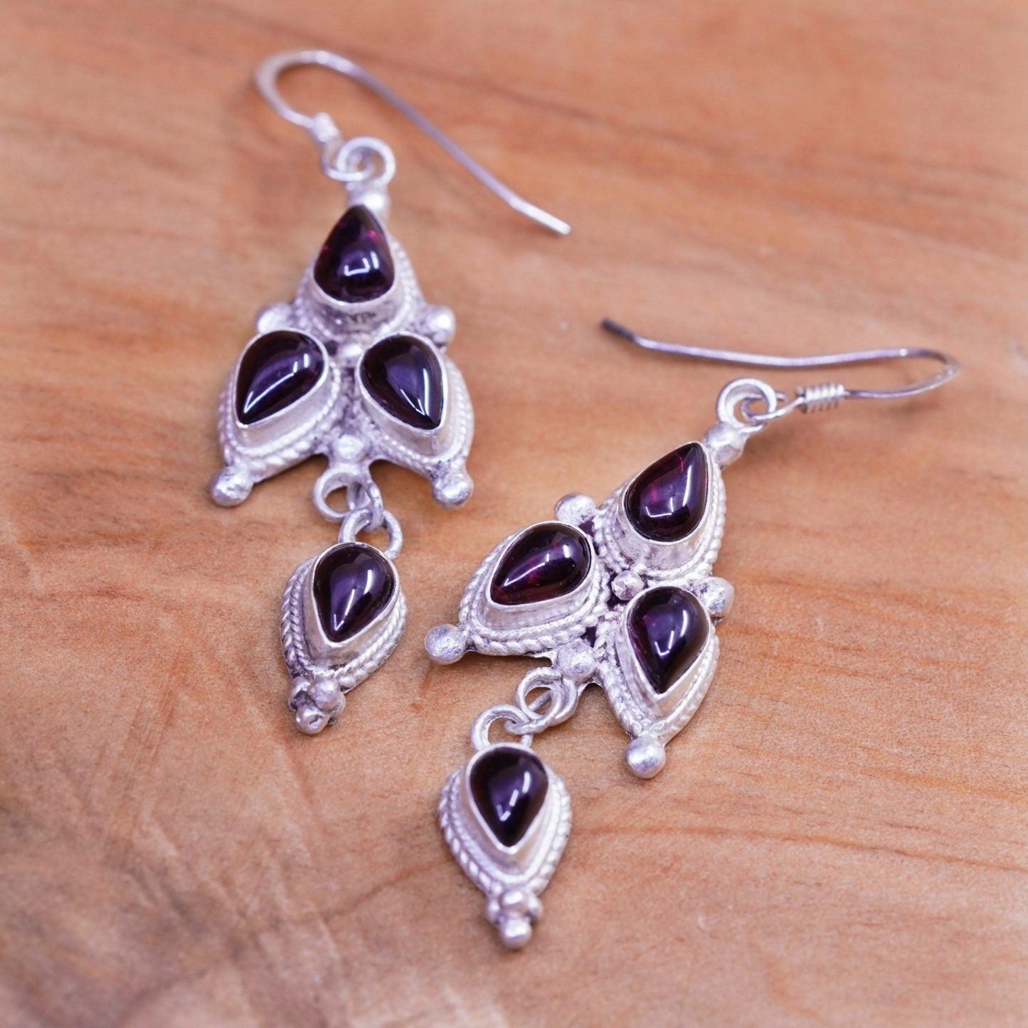 Vintage Nepal Sterling silver handmade earrings with teardrop garnet and cable