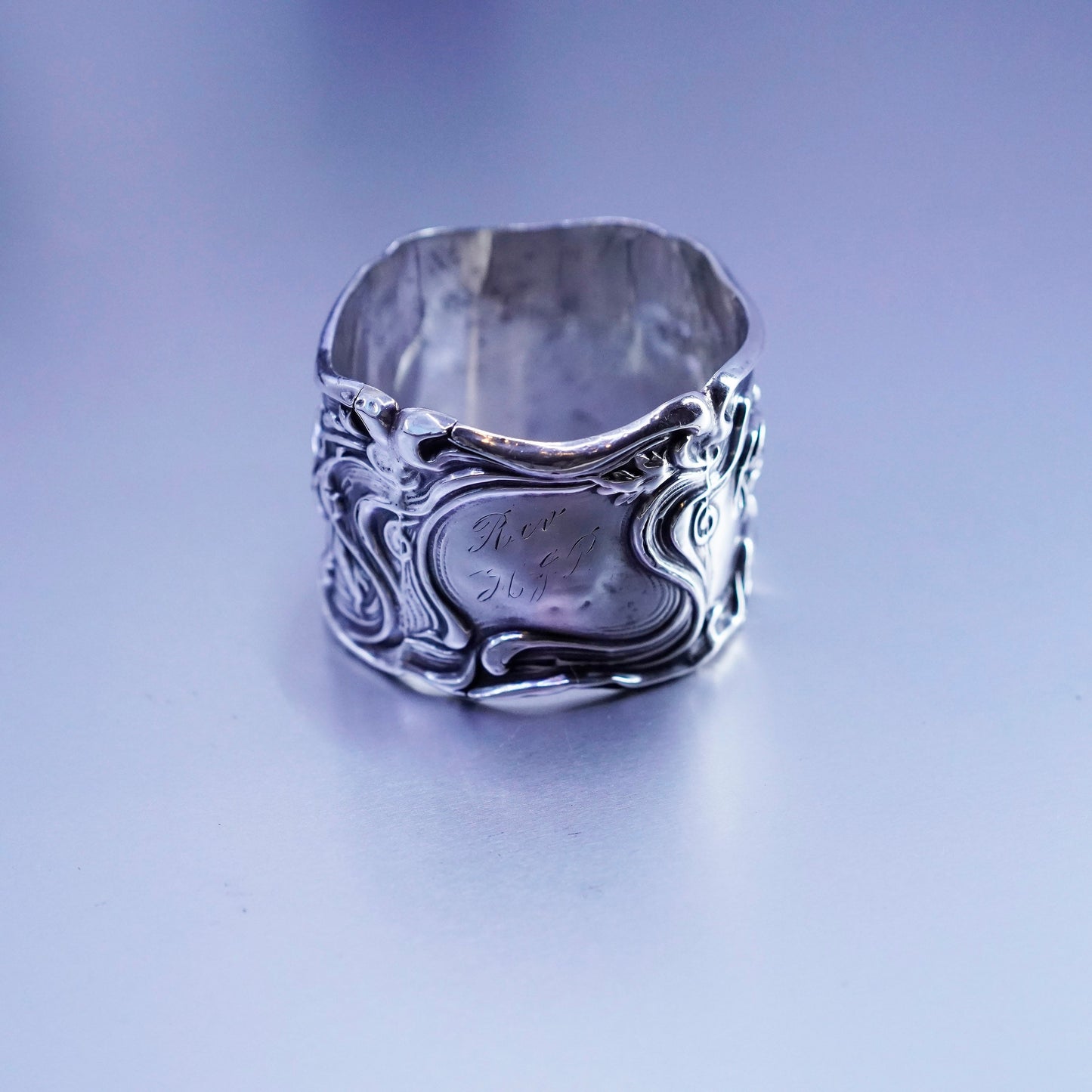 Vintage native American handmade napkin ring with floral pattern relief