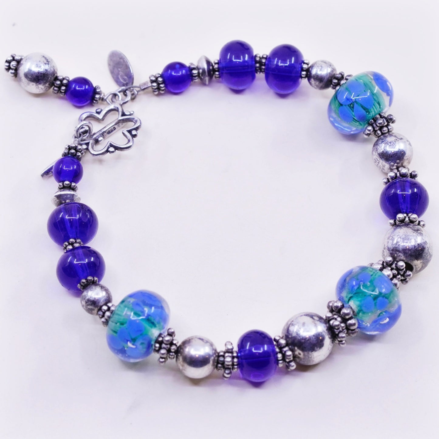 7.75”, vintage 925 Sterling silver bracelet with artisan blue glass beads