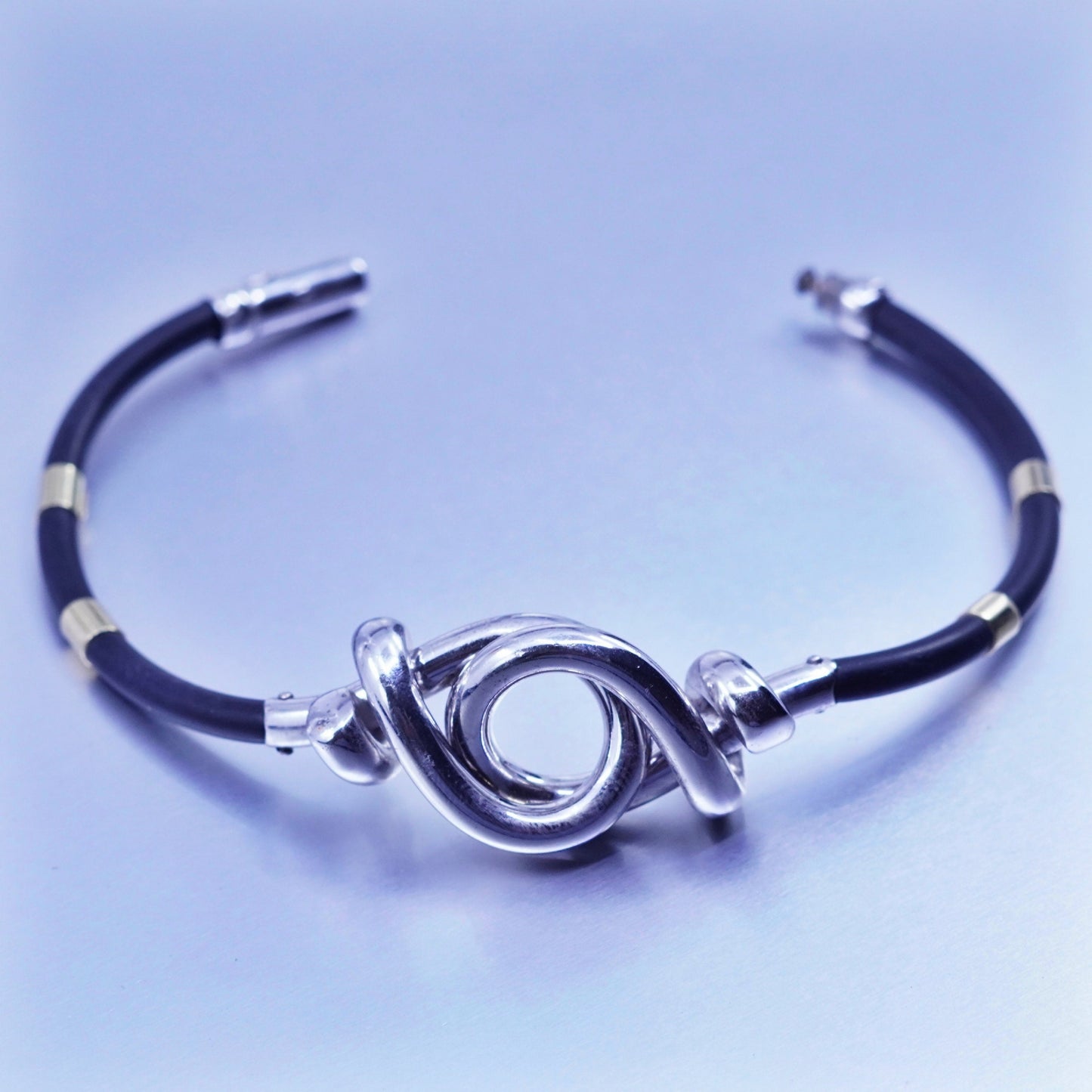 6.75”, sterling 925 silver knot bracelet with 14K gold tube black rubber chain