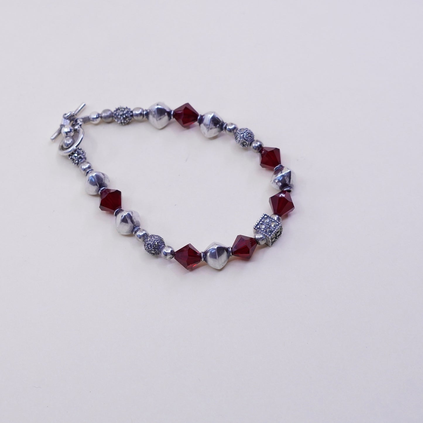 6.75”, handmade bracelet, ruby with sterling 925 silver beads N toggle closure