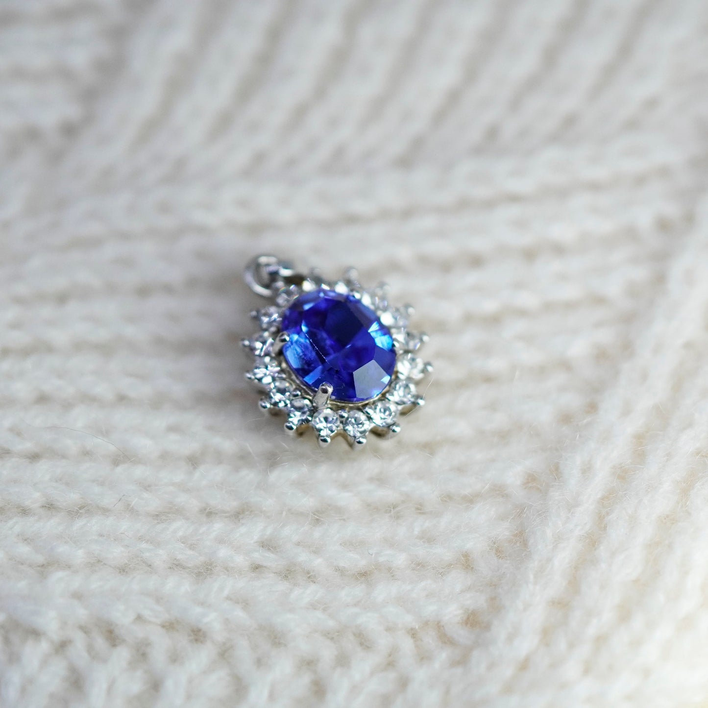 Vintage Sterling 925 silver pendant with oval blue topaz and cz around