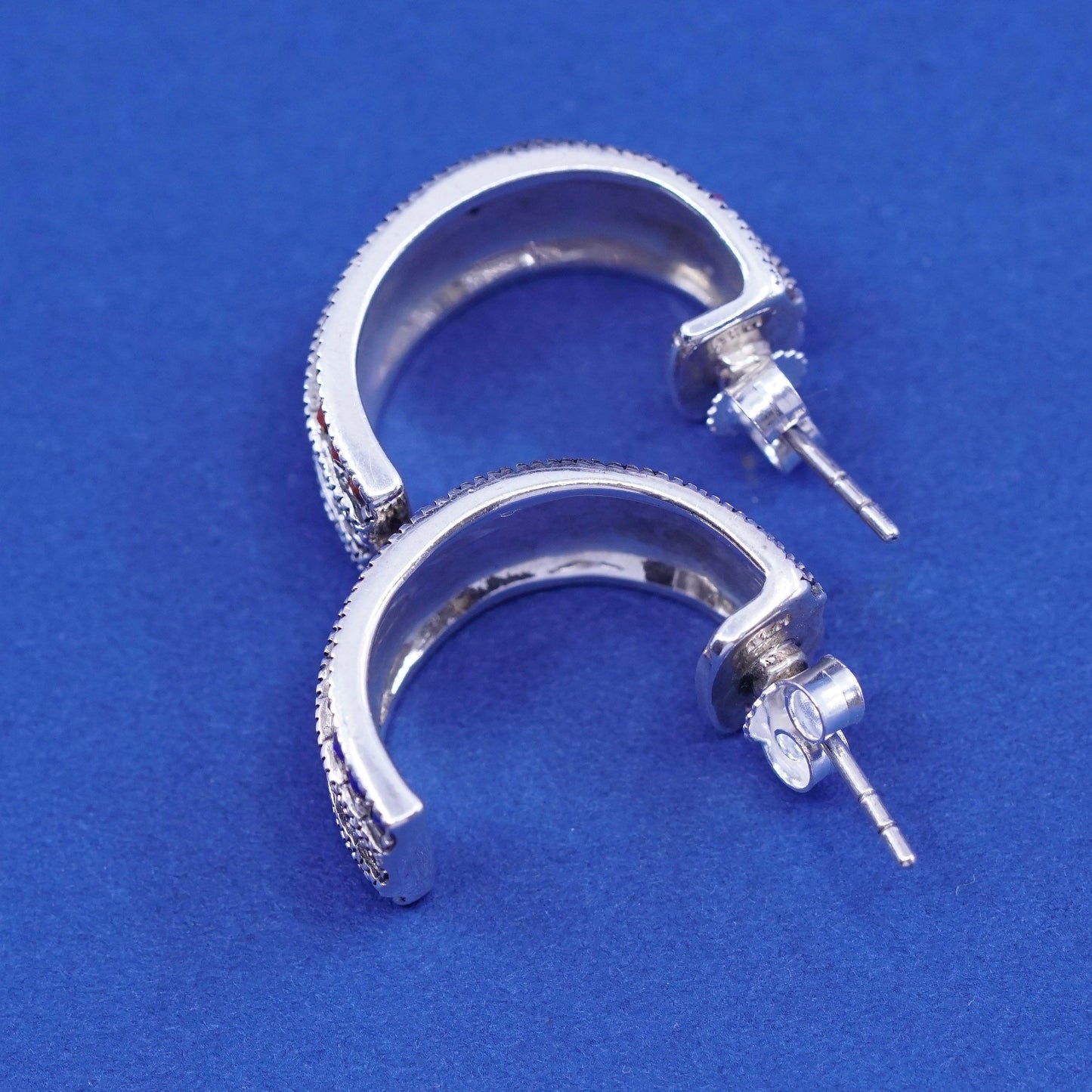 0.75”, Sterling silver earrings, 925 Huggie hoops w/ marcasite ruby Sapphire
