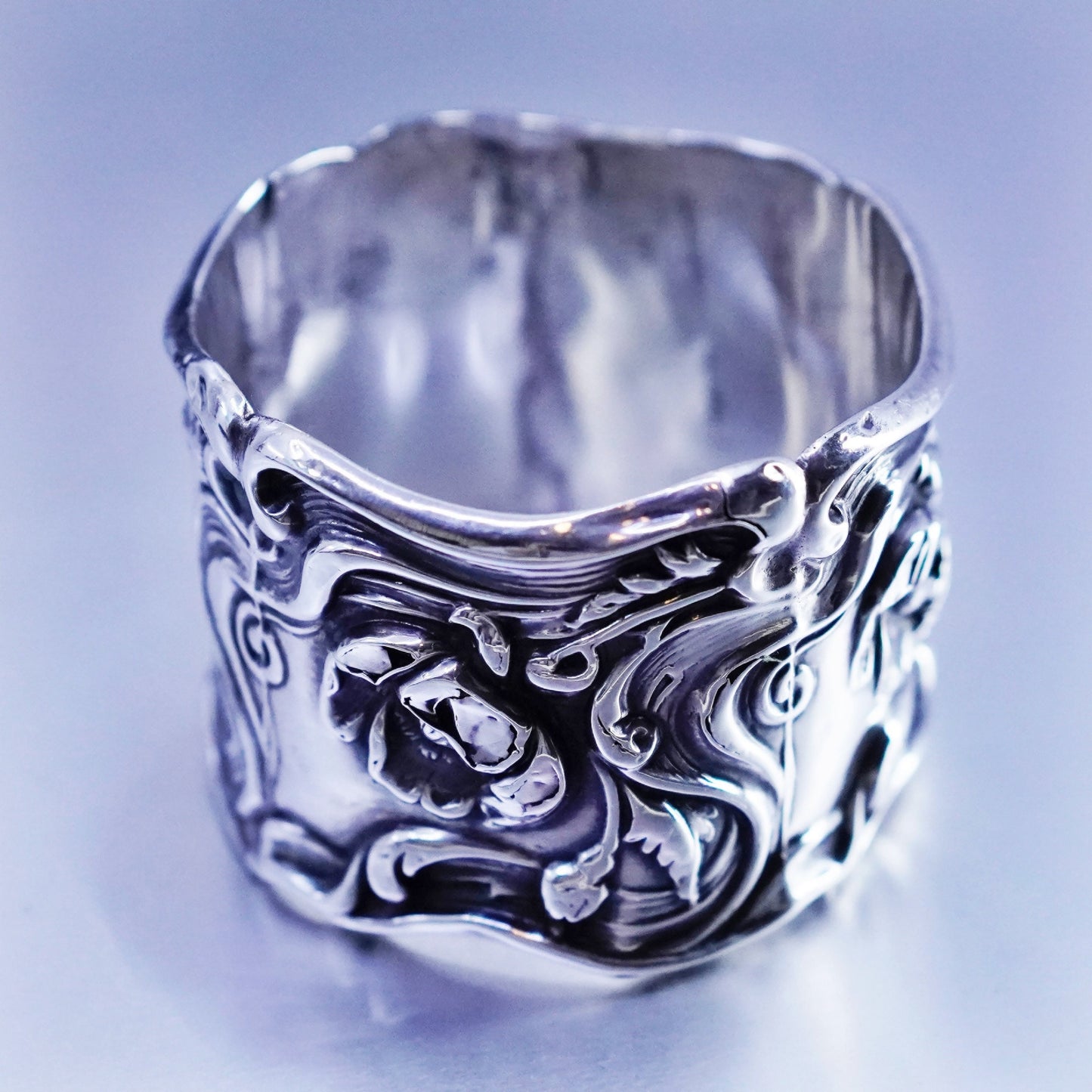 Vintage native American handmade napkin ring with floral pattern relief