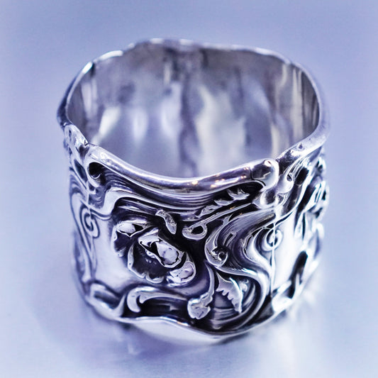 Vintage native American handmade napkin ring with floral pattern relief
