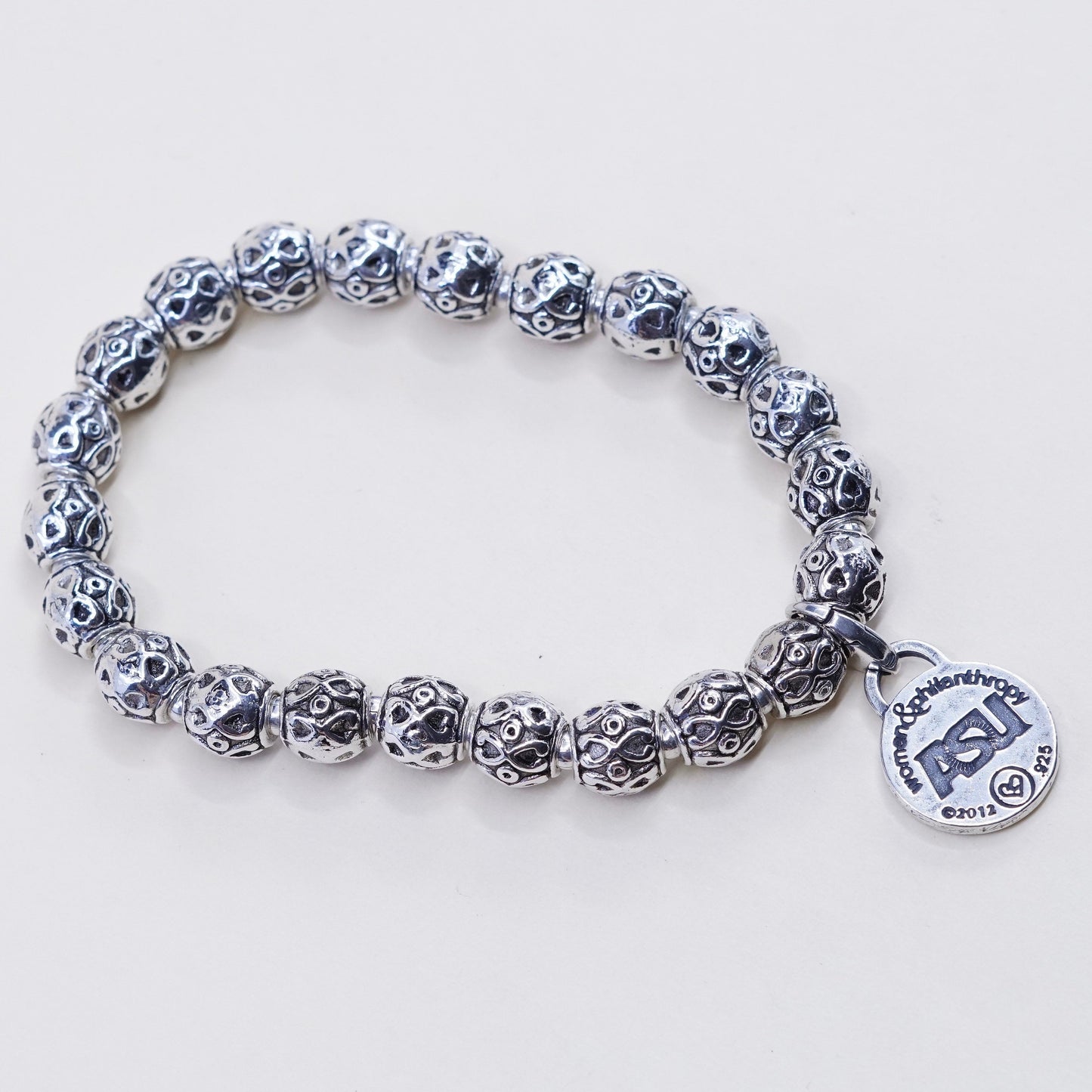 6.75”, sterling 925 silver handmade elastic bracelet textured beads N ASU charm