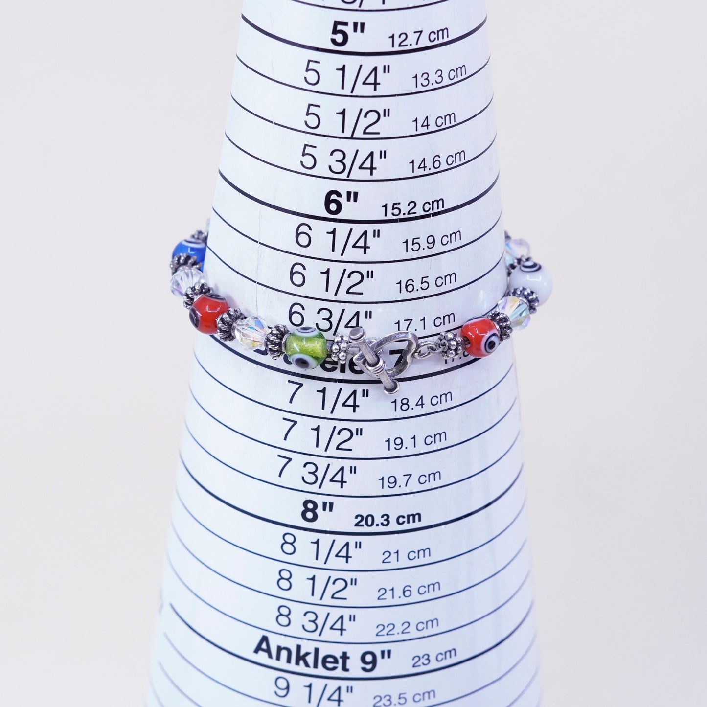 7”, handmade sterling silver bracelet, glass evil eye beads and heart closure