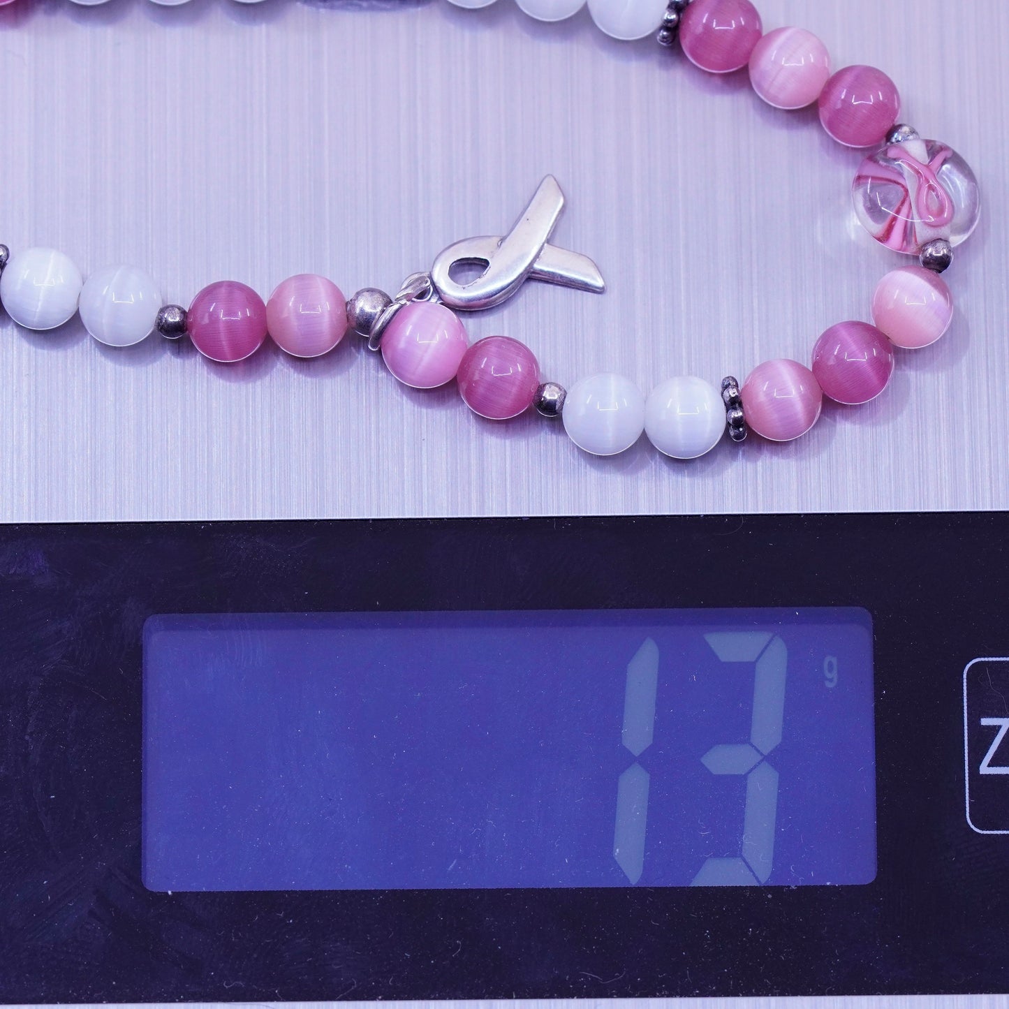 7.5”, “Hope” bracelet, pink cats eye beads elastic band 925 ribbon bow tie