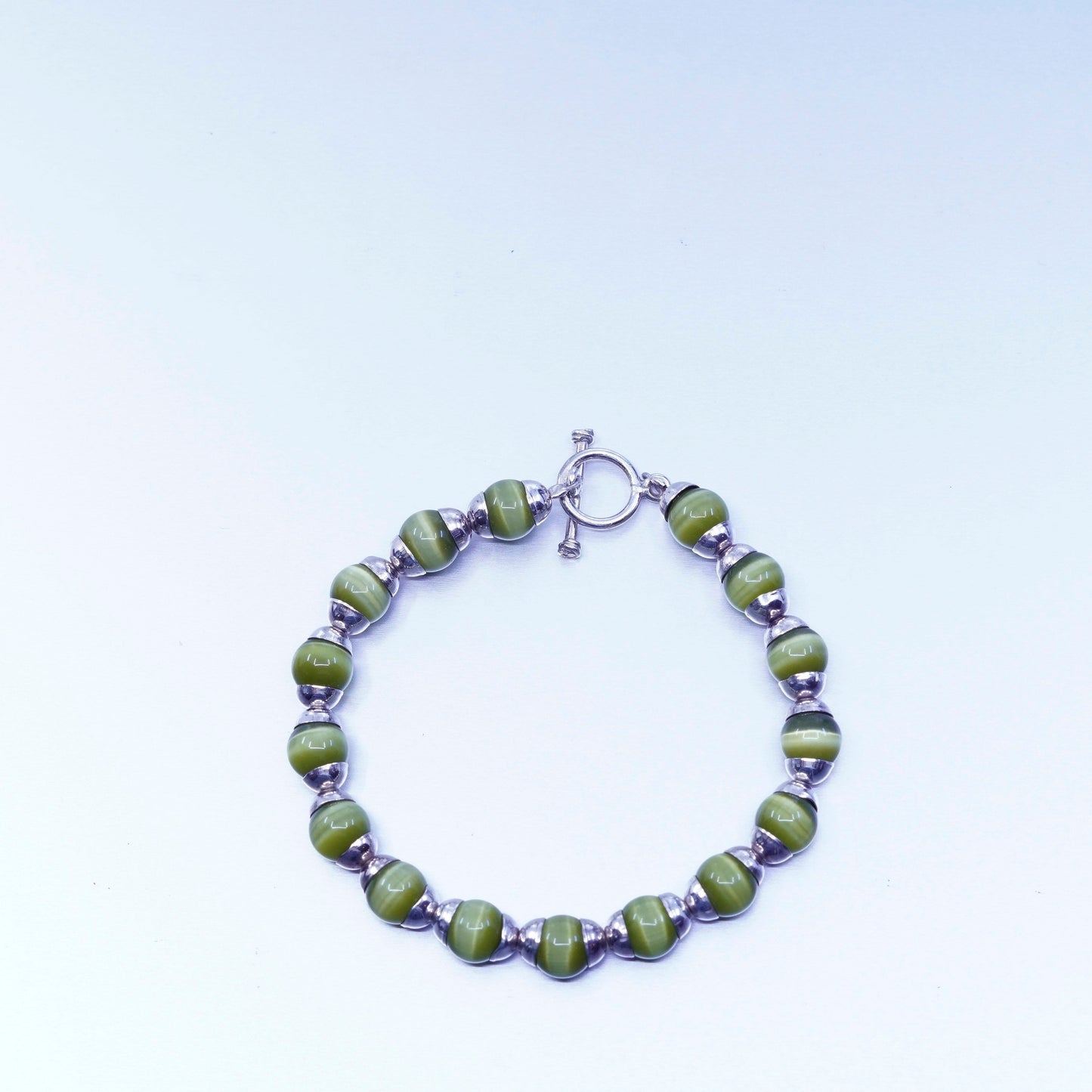 6.5”, Sterling 925 silver bracelet with green cat’s eye beads toggle closure