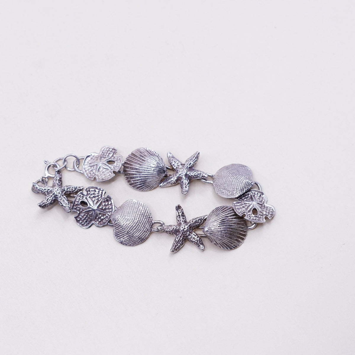 6.75”, ocean lover Sterling silver bracelet, 925 sand dollar, shell, starfish