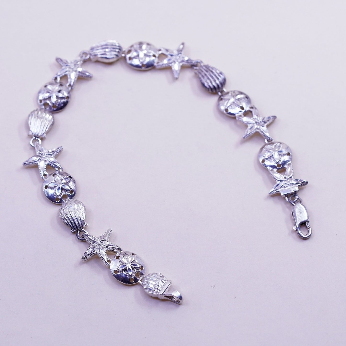 7.75”, ocean lover Sterling silver bracelet, 925 sand dollar, shell, starfish