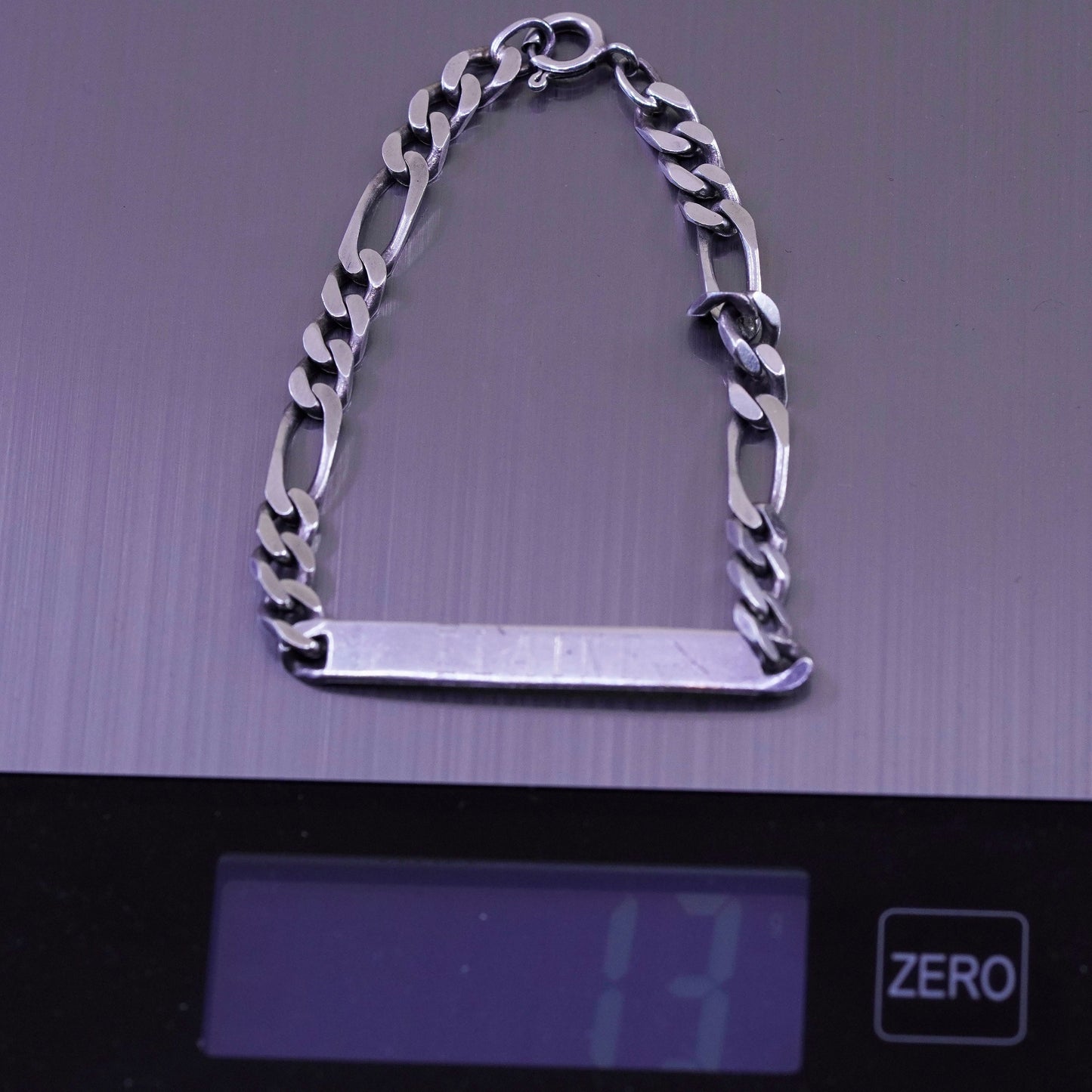 8” Sterling silver bracelet, 925 figaro chain name tag engraved “Elaine”