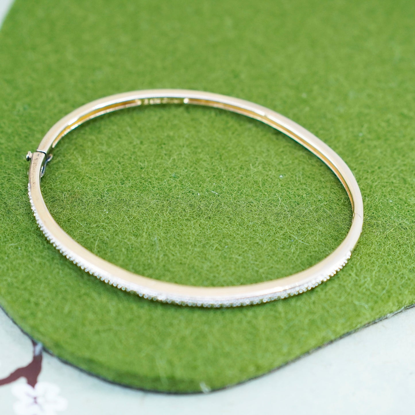 6.5”, vermeil gold over Sterling silver hinged bangle bracelet with diamond