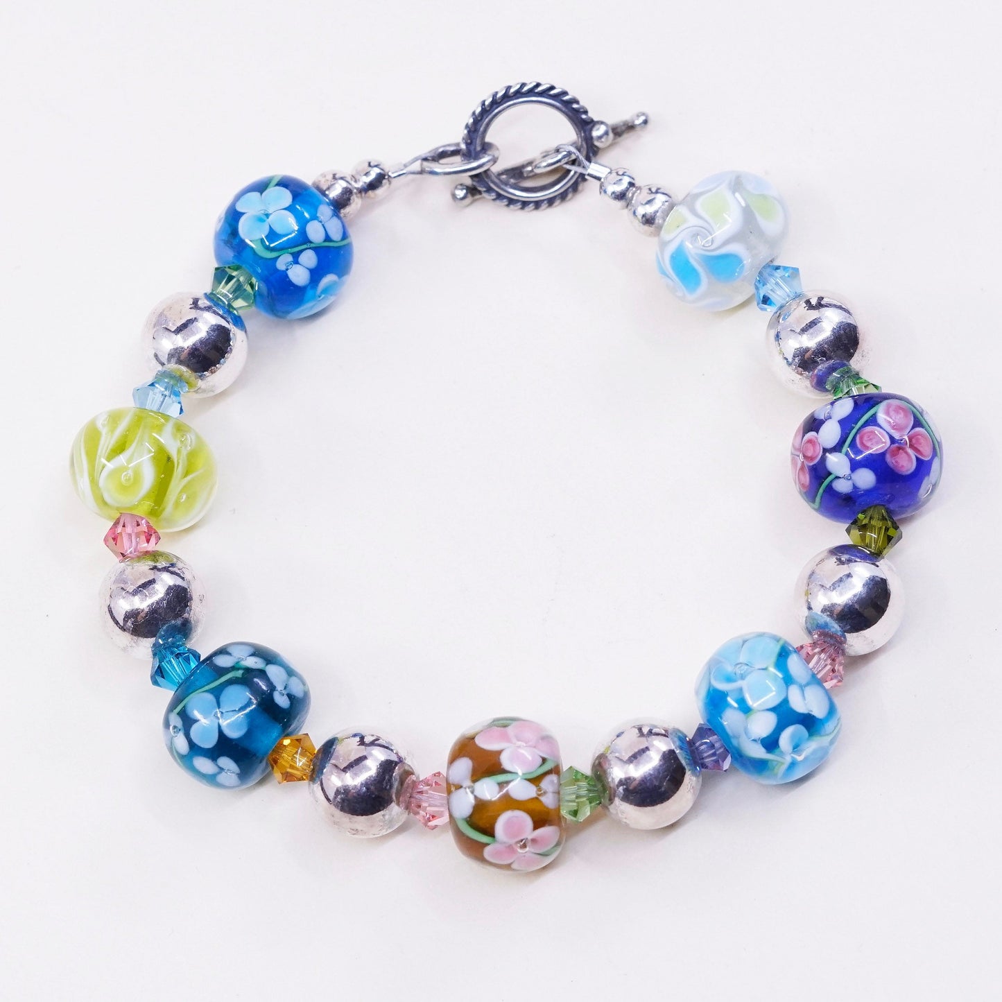 6.75”, vtg 925 Sterling silver bracelet w/ artisan floral glass beads N toggle