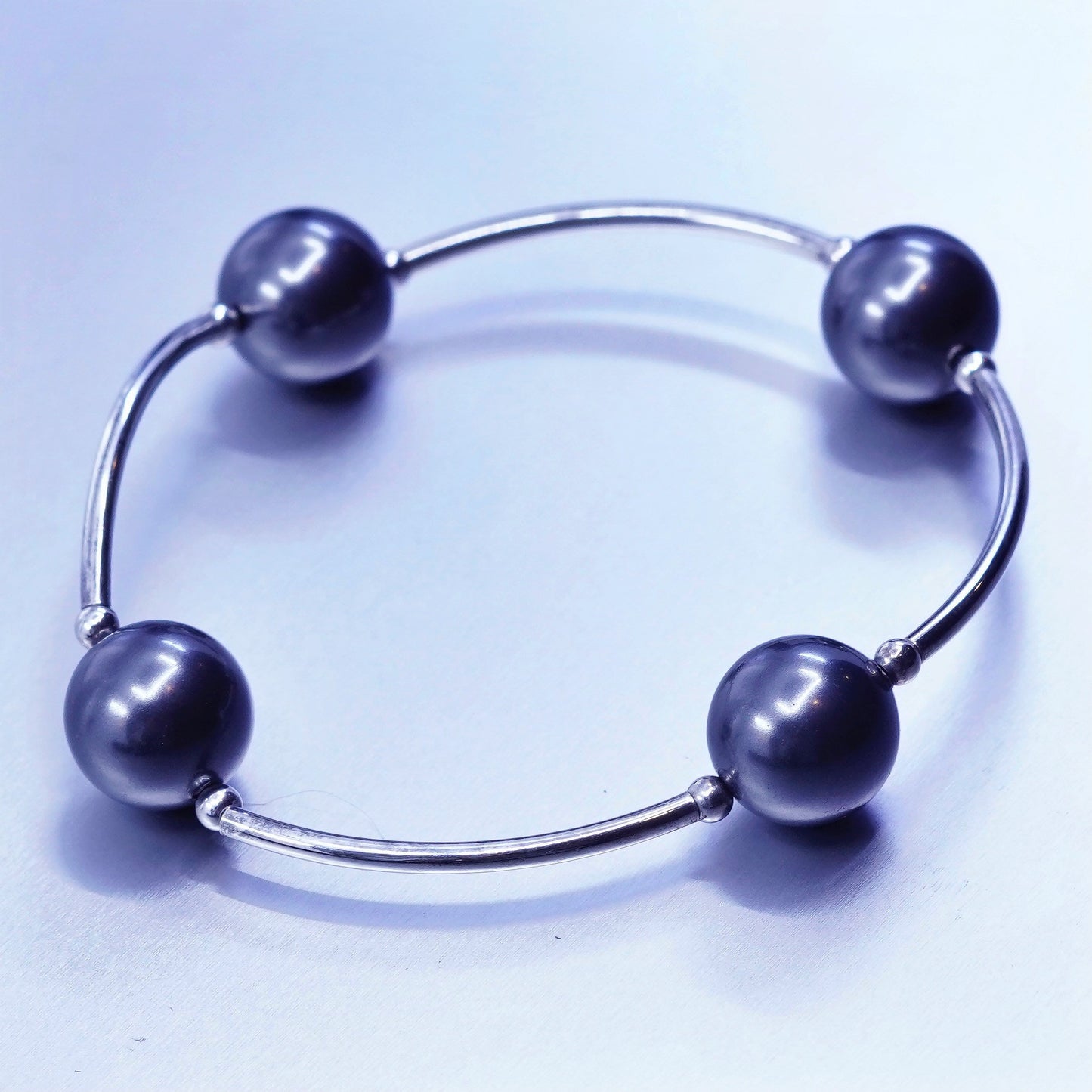 6.25”, Sterling 925 silver curvy bar bracelet with black pearl and elastic band