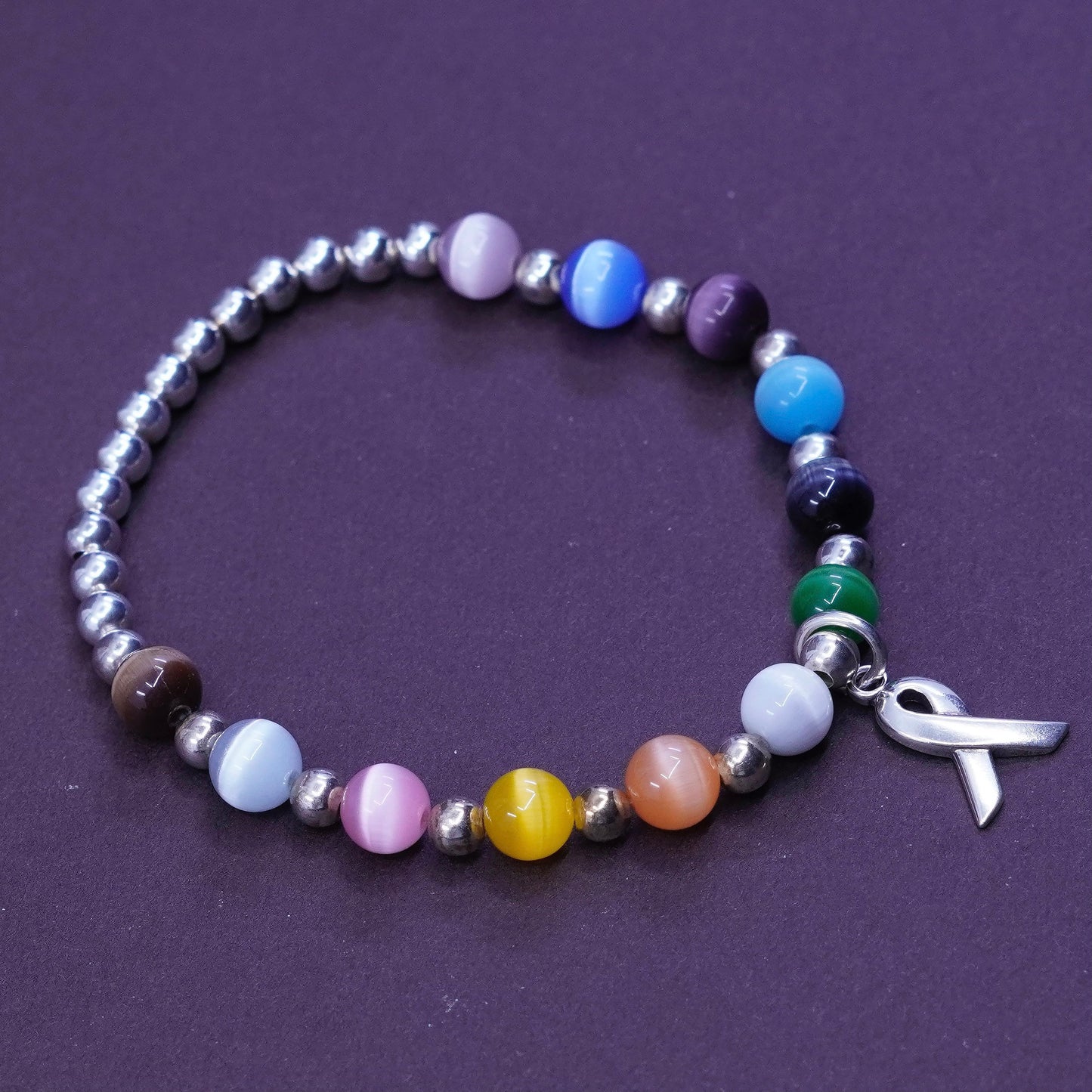 6”, Sterling 925 silver bracelet, elastic band with colorful cat eyes and beads