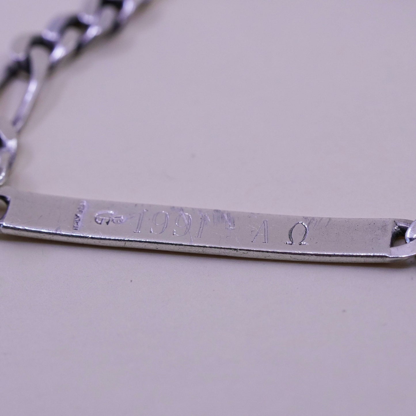 8” Sterling silver bracelet, 925 figaro chain name tag engraved “Elaine”