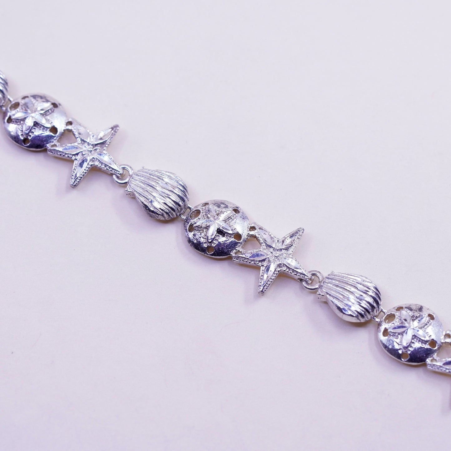 7.75”, ocean lover Sterling silver bracelet, 925 sand dollar, shell, starfish
