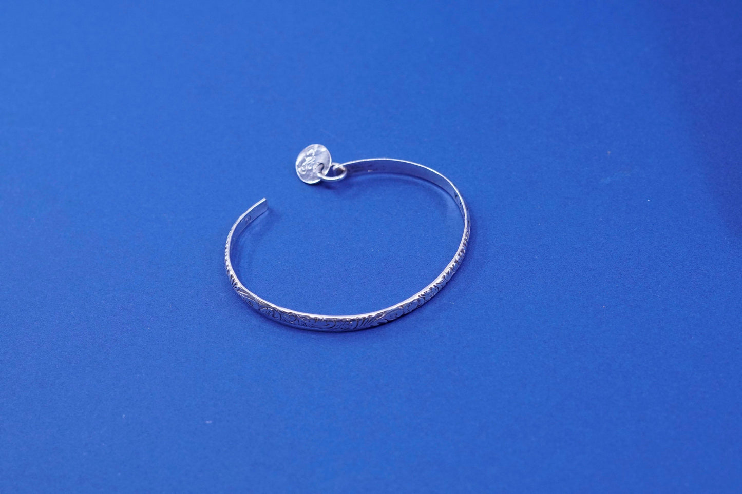 6.75”, sterling silver handmade bracelet, 925 textured cuff w/ “K” charm