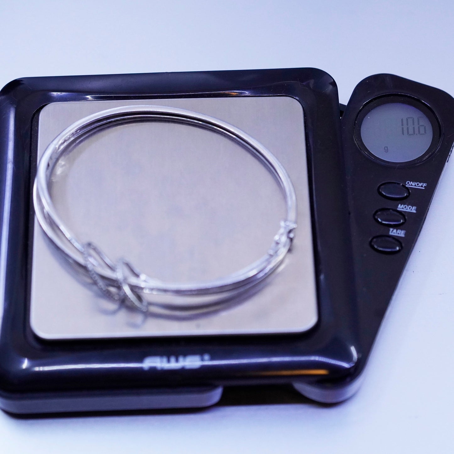 7”, Sterling 925 silver bracelet, entwined hinged bangle with cluster diamonds