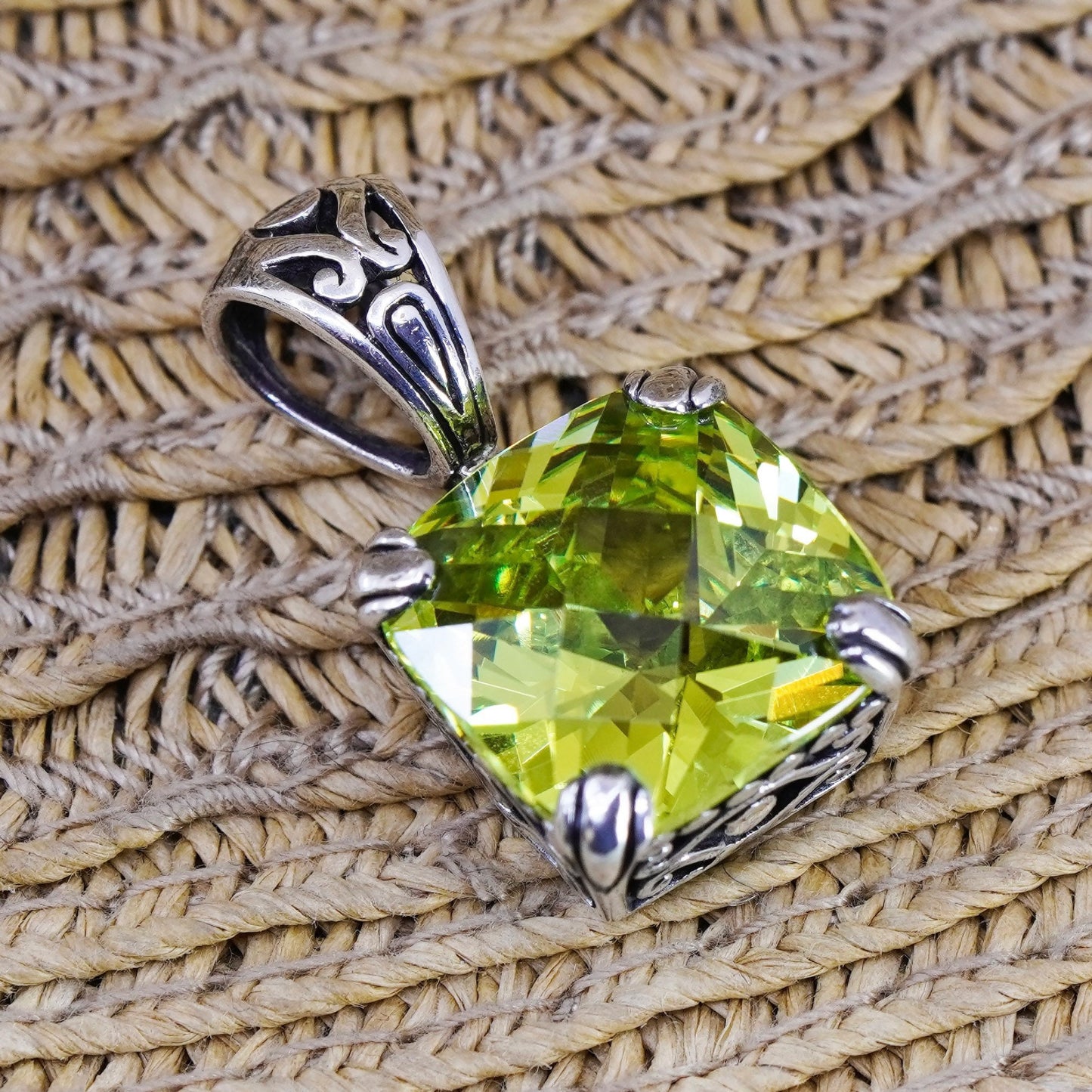 Vintage Sterling 925 silver pendant with peridot evil eye embossed on the side