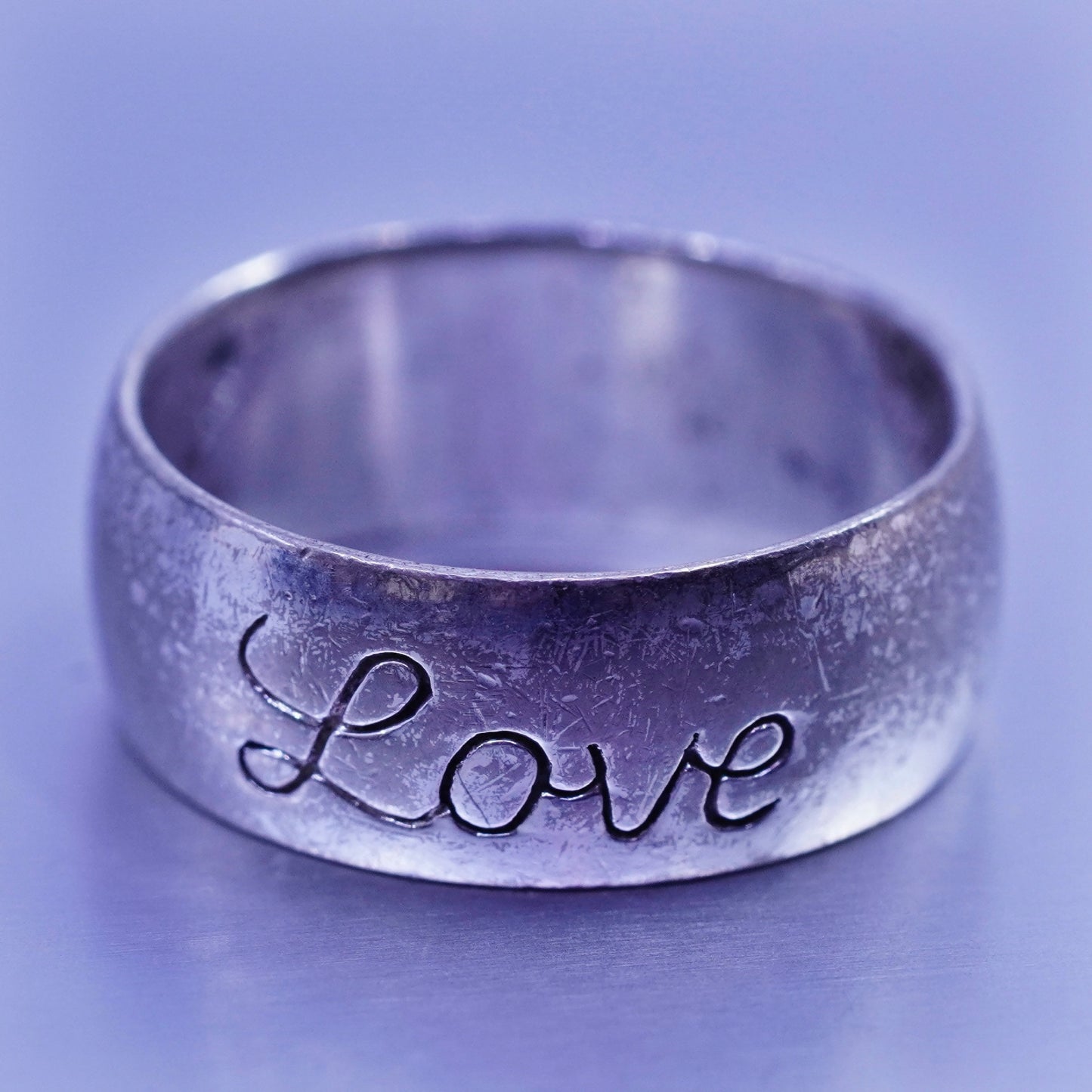 Size 5.5, vintage southwestern Sterling 925 silver wedding ring, band “love