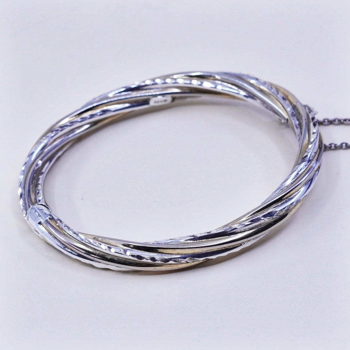 7.25”, two tone sterling silver bracelet, 925 hinged diamond twisted bangle
