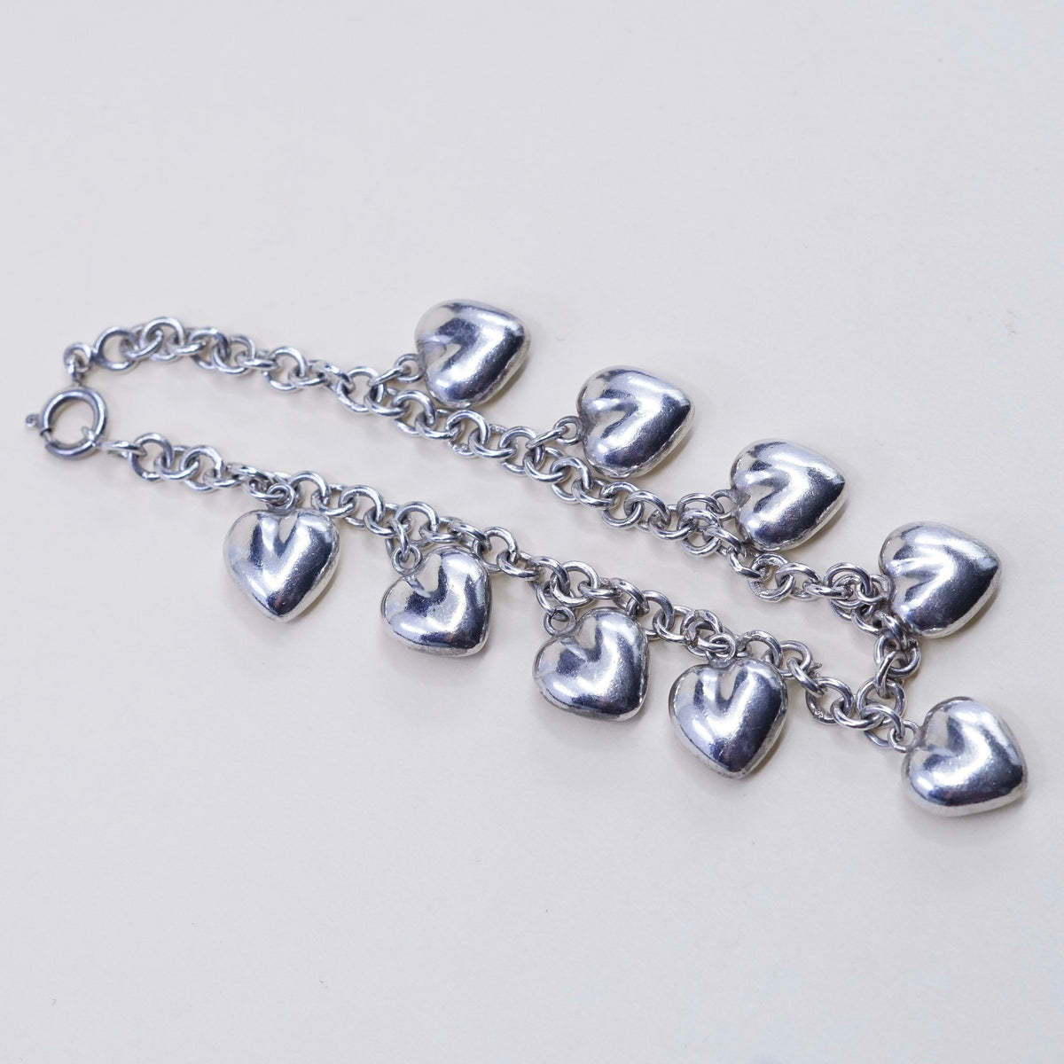 7.75”, 3mm, vtg JCM sterling 925 silver circle bracelet w/ cluster heart charms