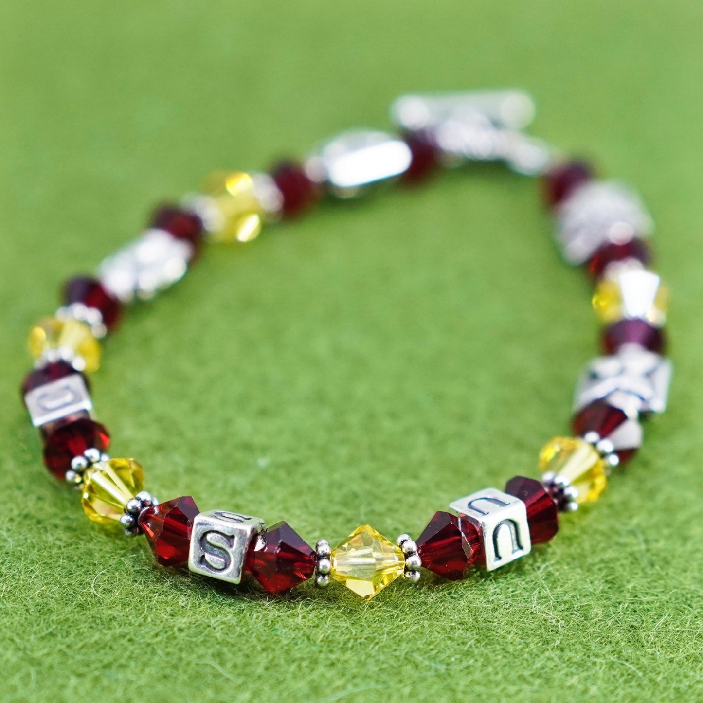 7”, vintage 925 sterling silver bracelet with red yellow crystal and USC cubes