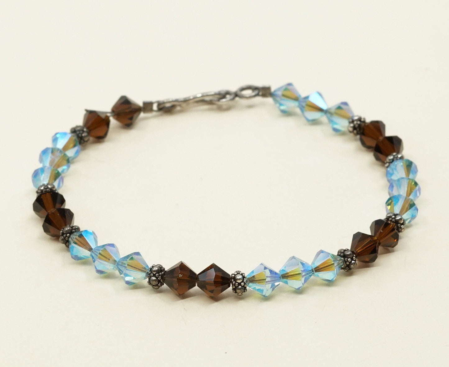 7.5”, VTG Sterling silver handmade bracelet w/ brown N blue Swarovski crystal
