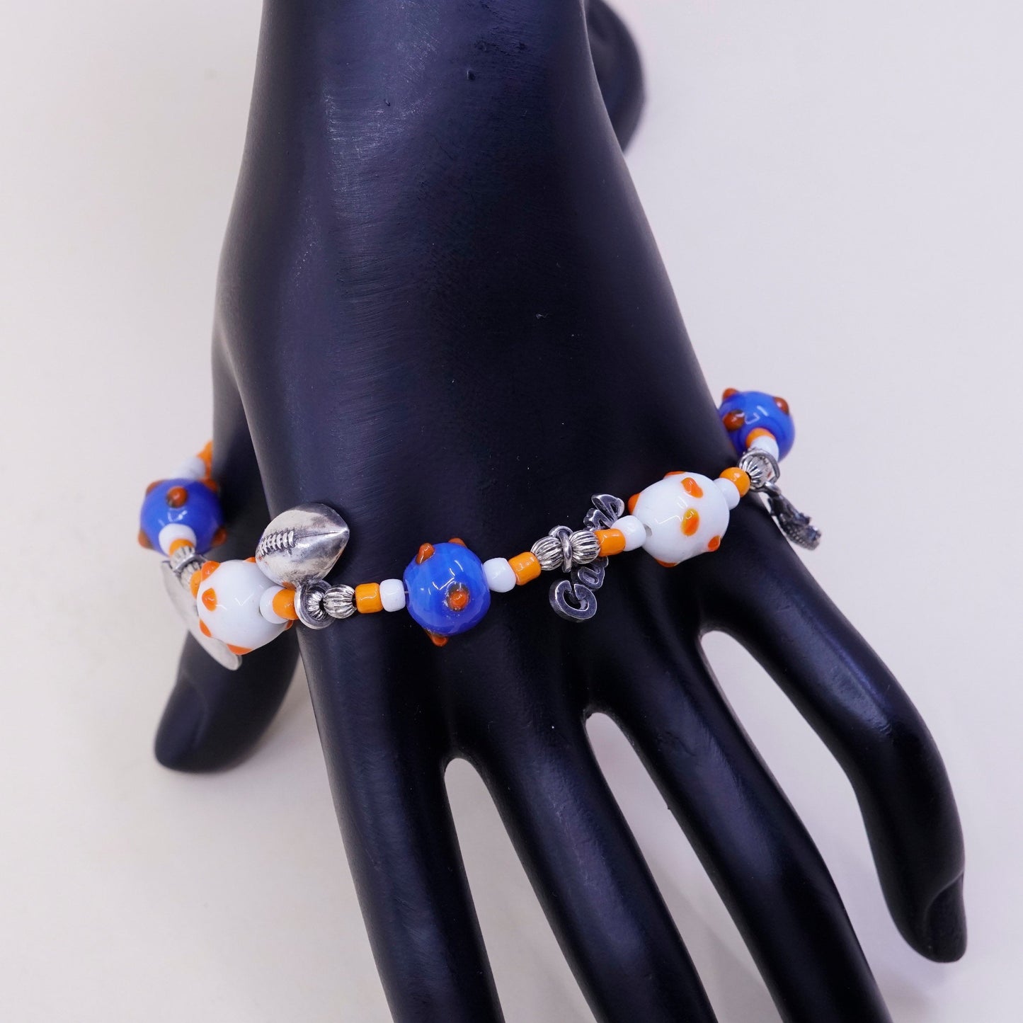 7.75”, blue and orange glass beads w/ sterling 925 silver alligator football