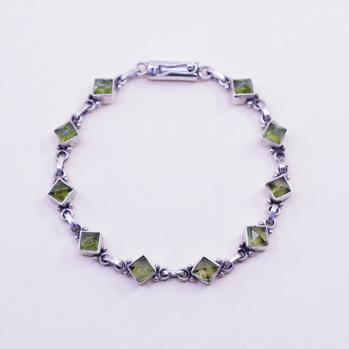7.25”, Vintage Sterling 925 silver handmade bracelet with diamond cut peridot
