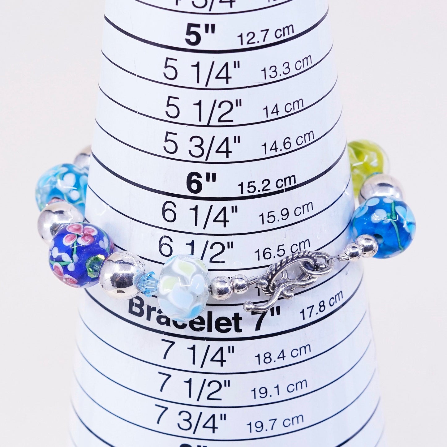 6.75”, vtg 925 Sterling silver bracelet w/ artisan floral glass beads N toggle