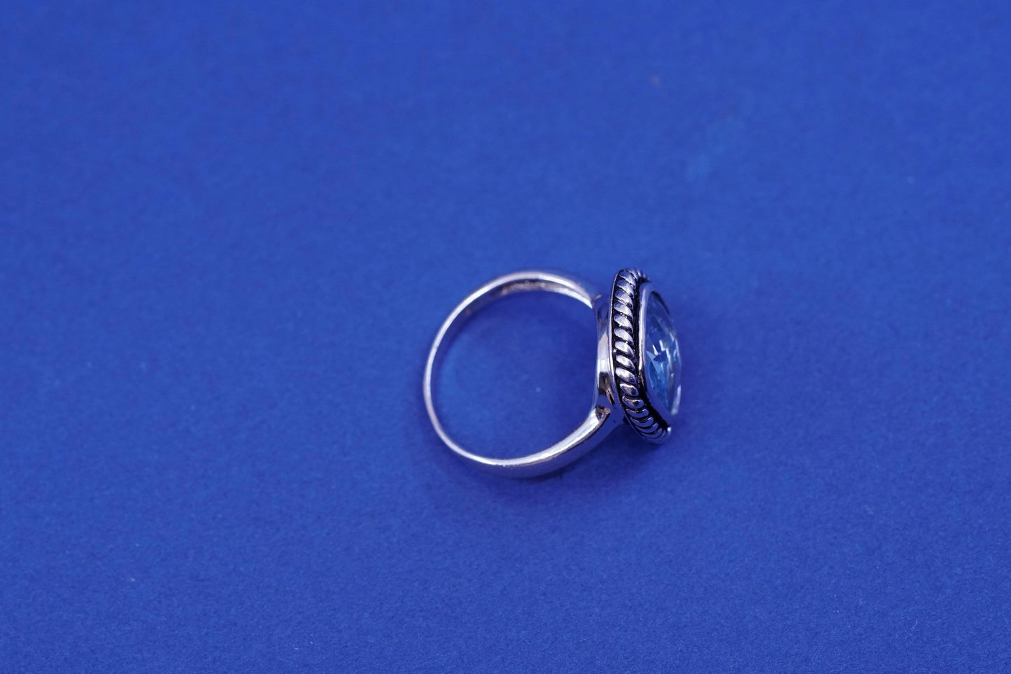 Size 7.75, vintage sterling 925 silver handmade ring with blue topaz and cable