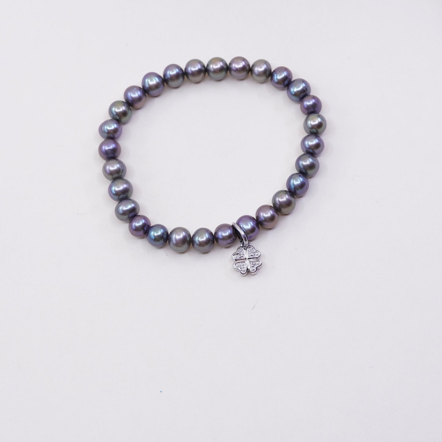 7”, bracelet, black pearl with elastic band and 925 silver lucky clover charm,