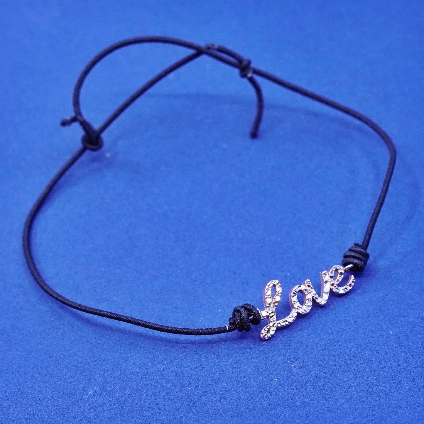 7.5”, vermeil gold over Sterling silver bracelet, elastic band “love” charm