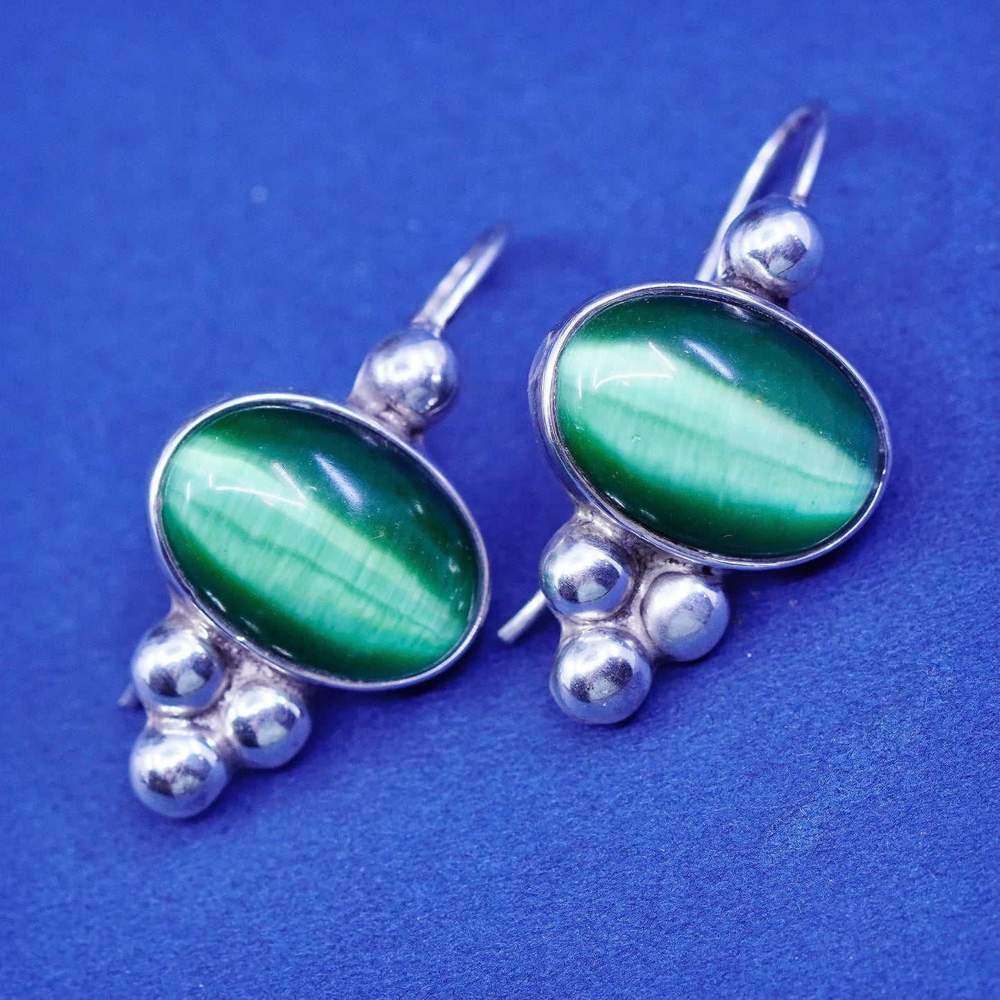 Sterling silver handmade earrings, mexico 925 with lime green cats eye and bead