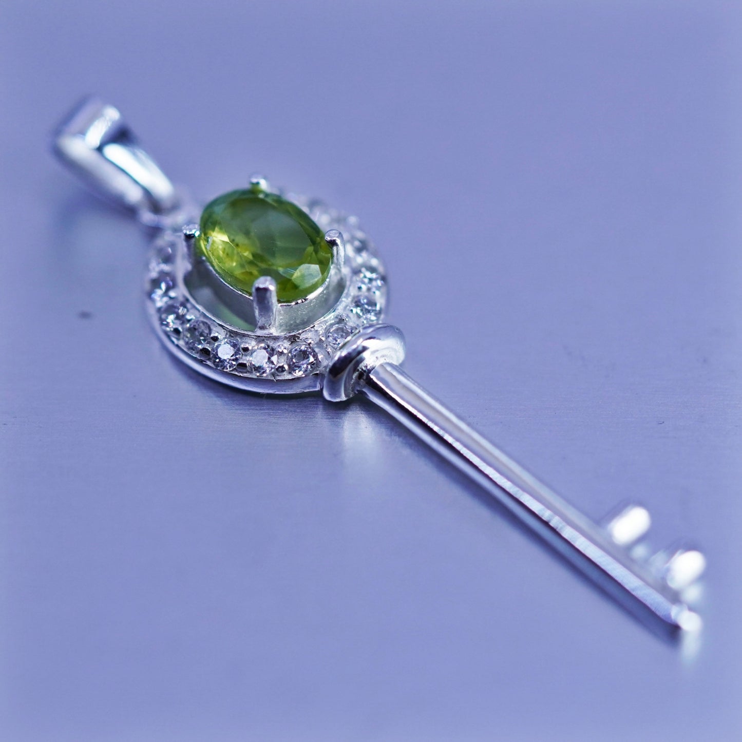 Vintage sterling 925 silver key pendant with peridot and cz