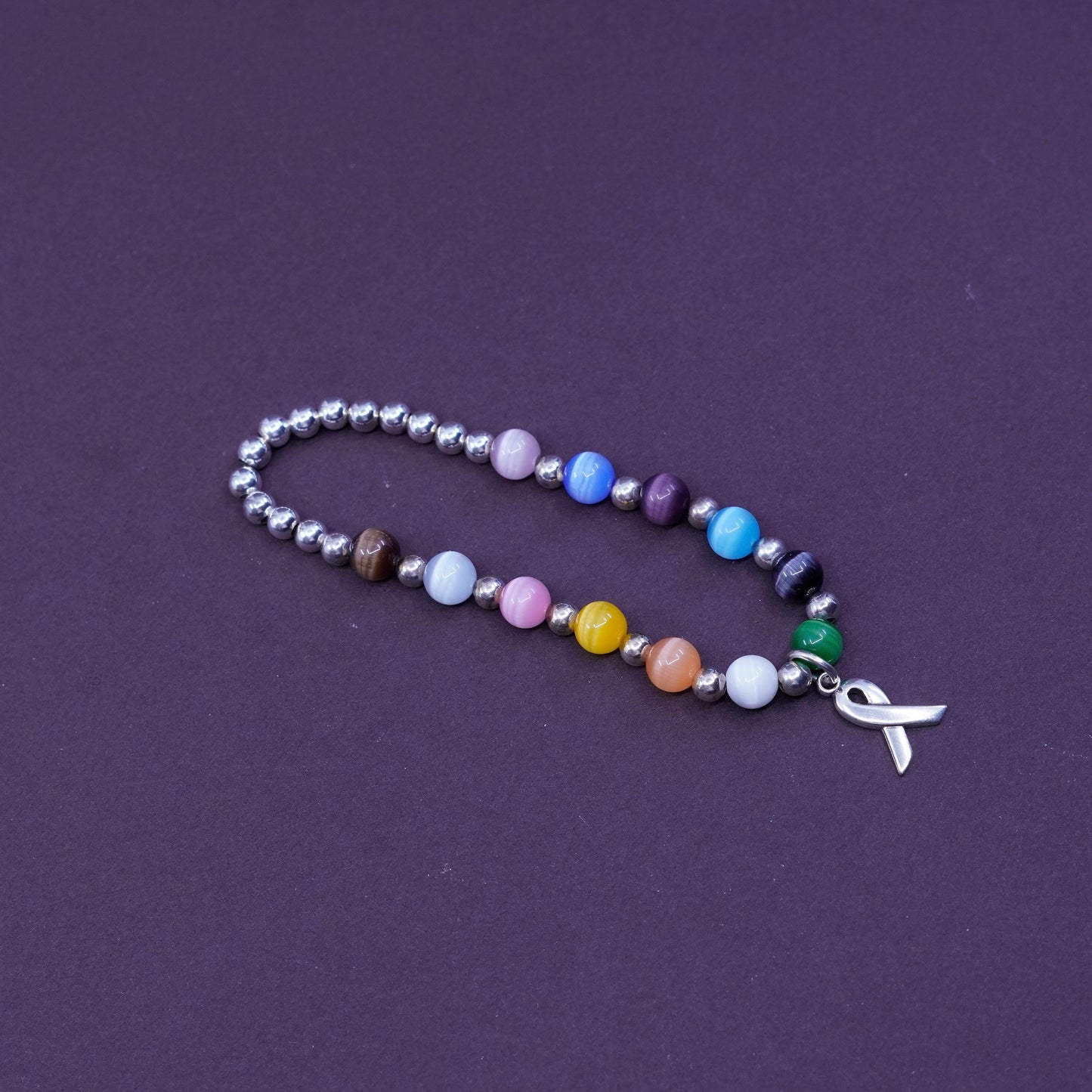 6”, Sterling 925 silver bracelet, elastic band with colorful cat eyes and beads