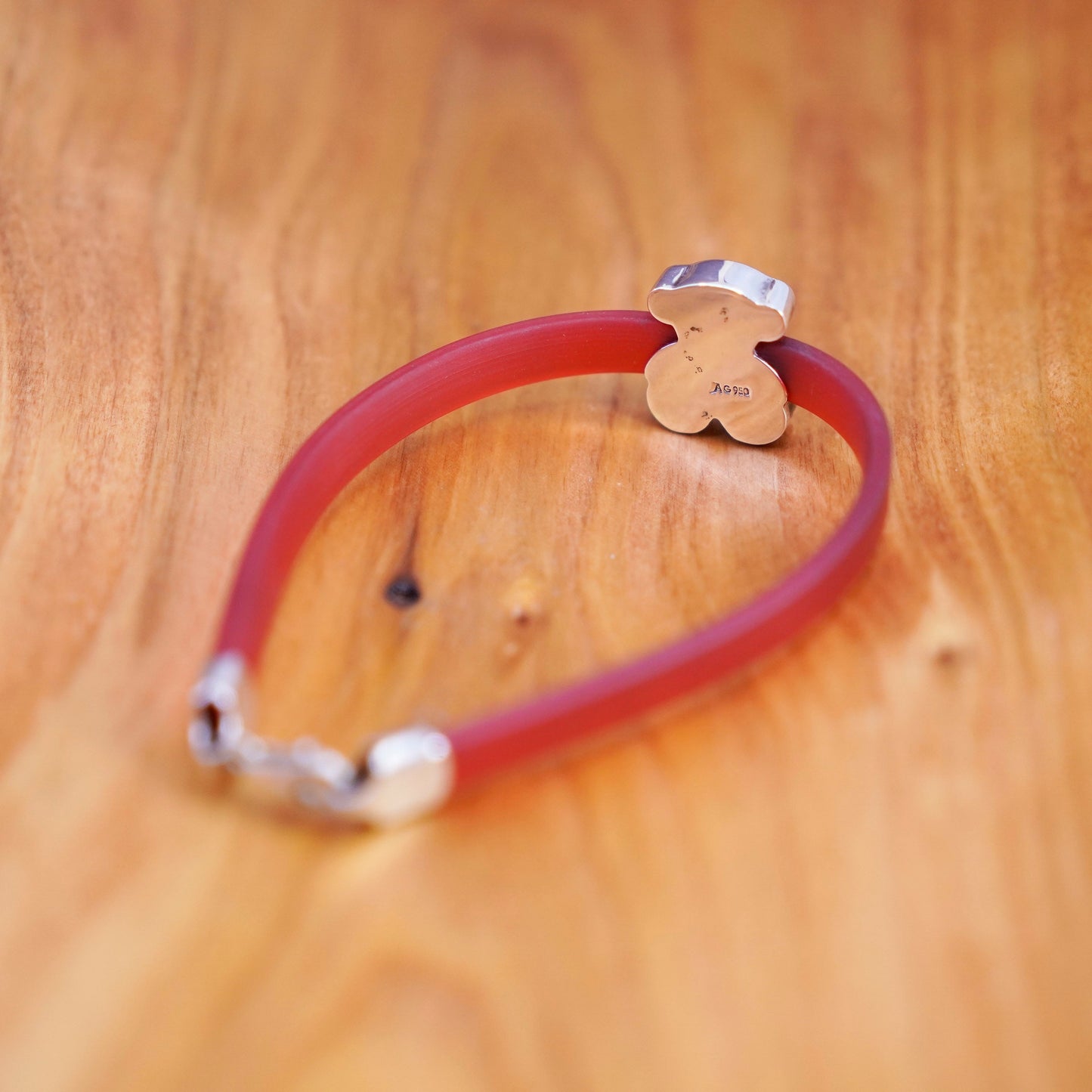 6.5”, vintage AG red rubber bracelet with sterling 925 silver teddy bear charm