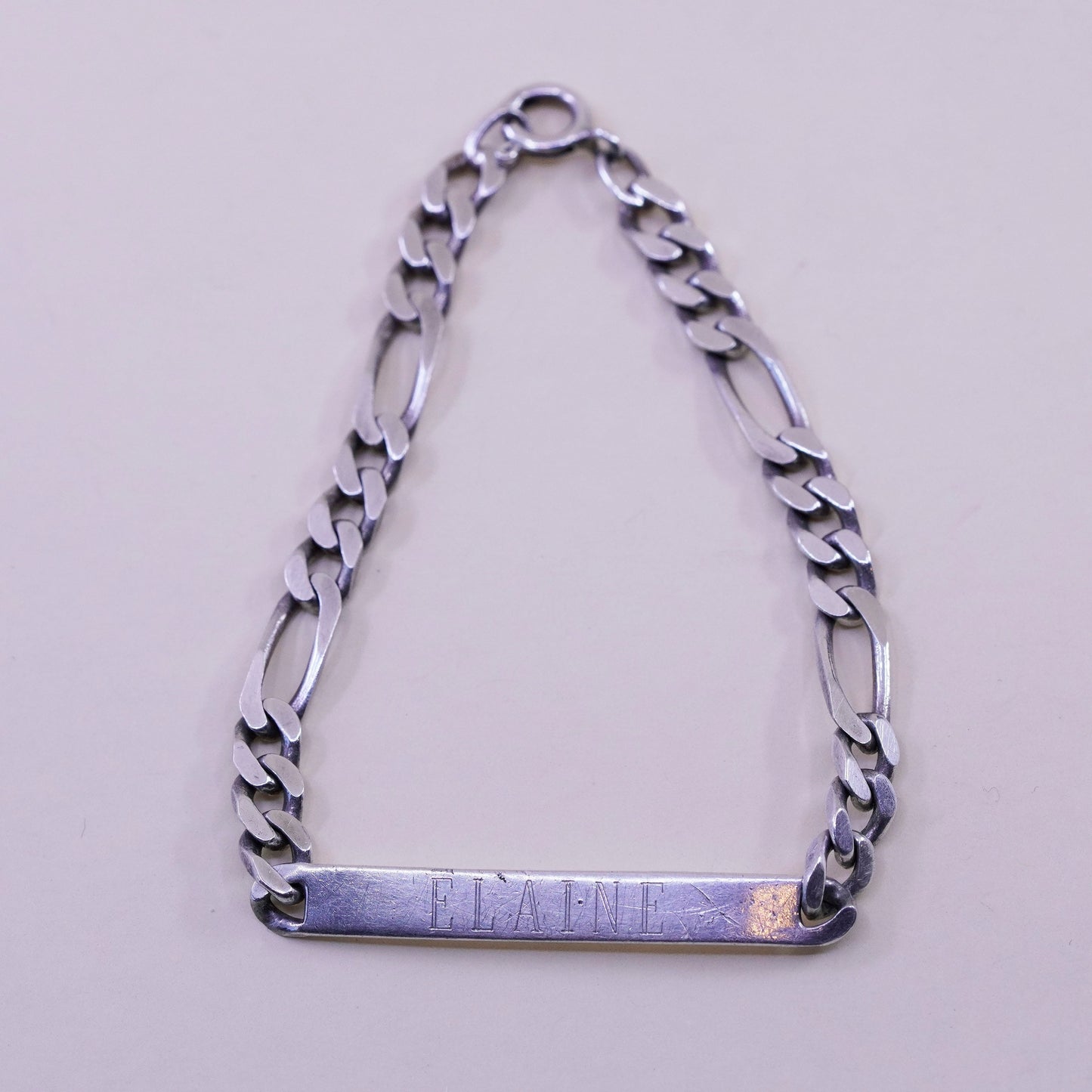 8” Sterling silver bracelet, 925 figaro chain name tag engraved “Elaine”