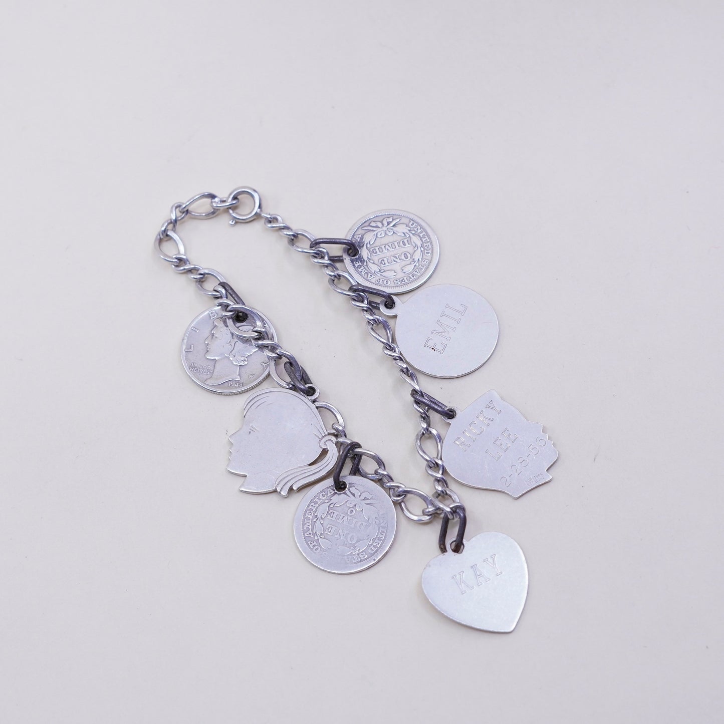 7”, sterling silver handmade bracelet, 925 Figaro chain w/ coin charms names