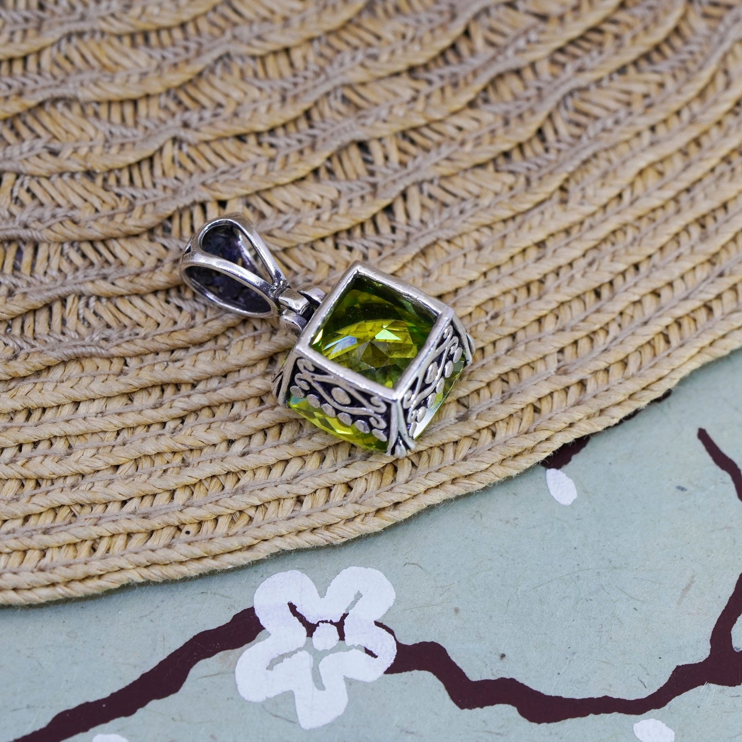 Vintage Sterling 925 silver pendant with peridot evil eye embossed on the side