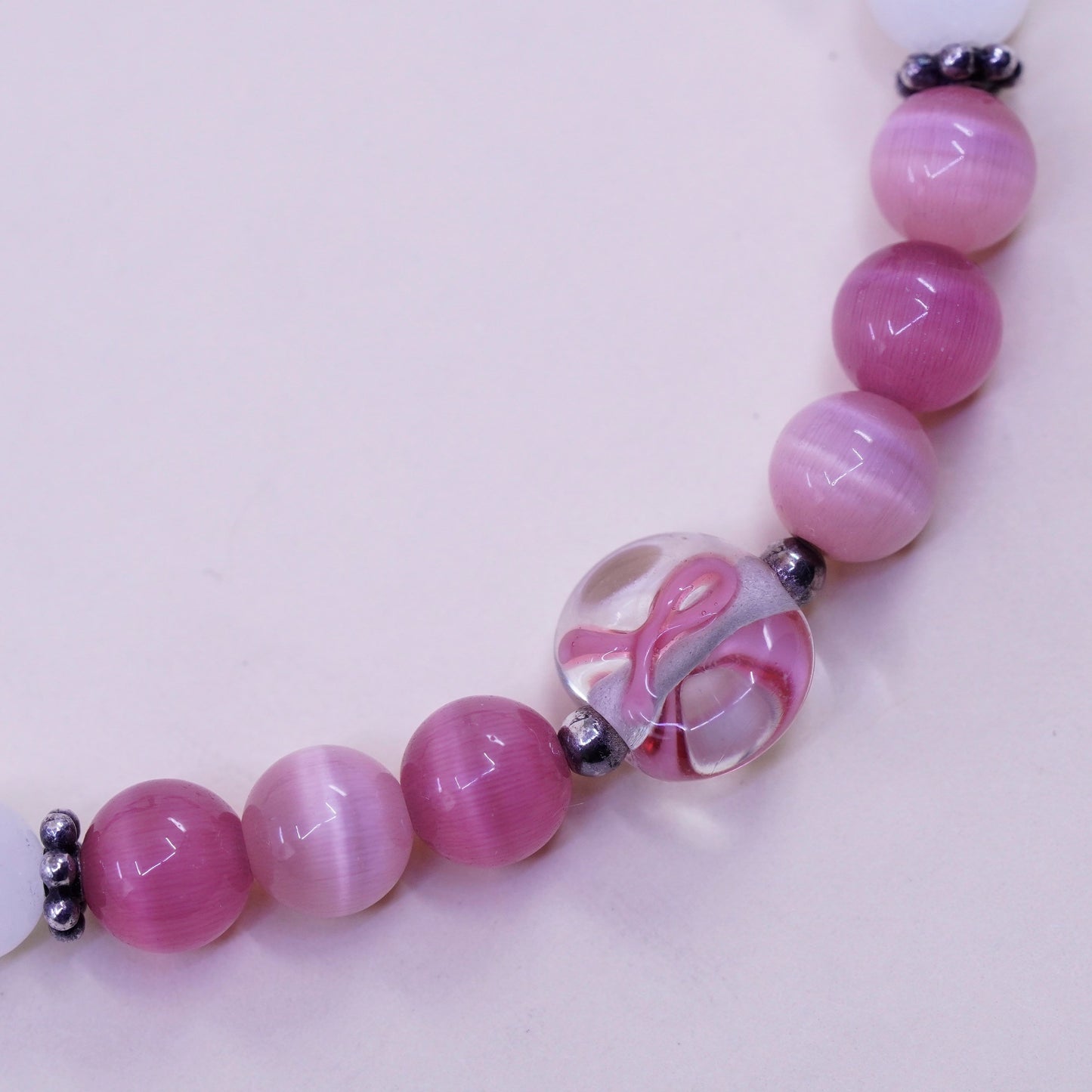 7.5”, “Hope” bracelet, pink cats eye beads elastic band 925 ribbon bow tie