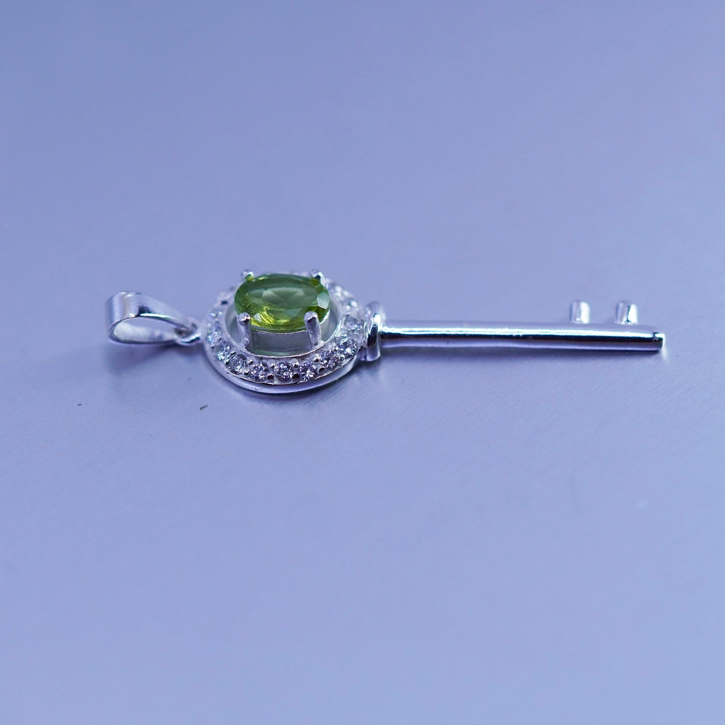 Vintage sterling 925 silver key pendant with peridot and cz