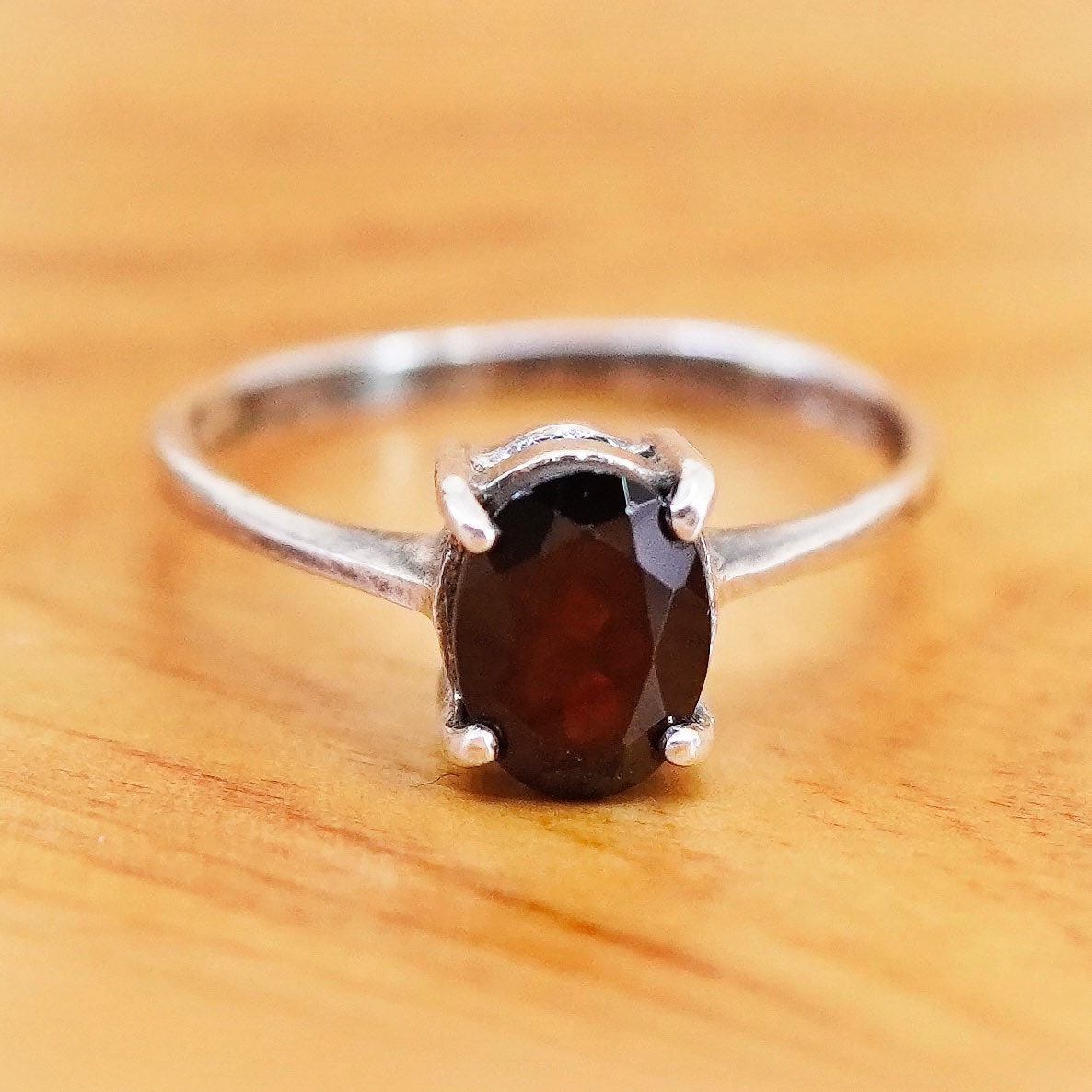 Size 6, size adjustable. vintage Sterling 925 stackable ring with oval garnet