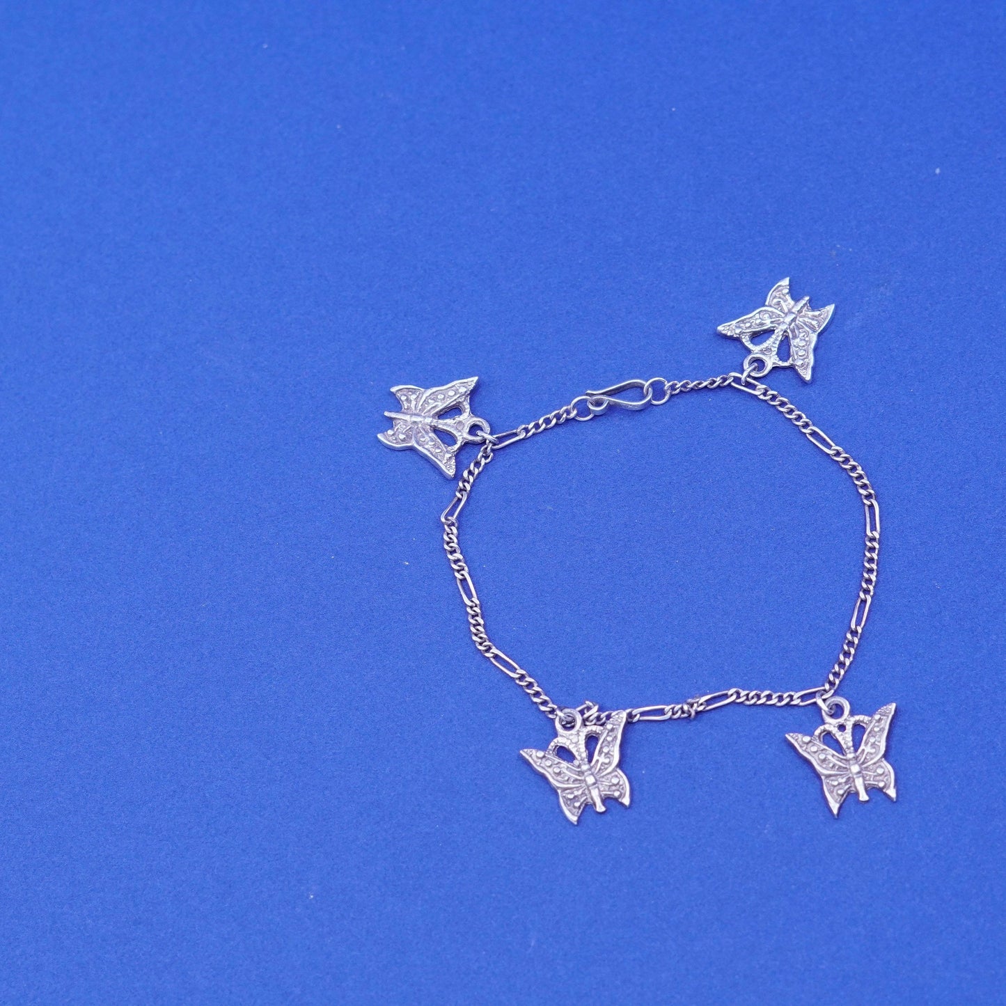 6.5”, vintage Sterling 925 silver figaro bracelet, chain with butterfly charms