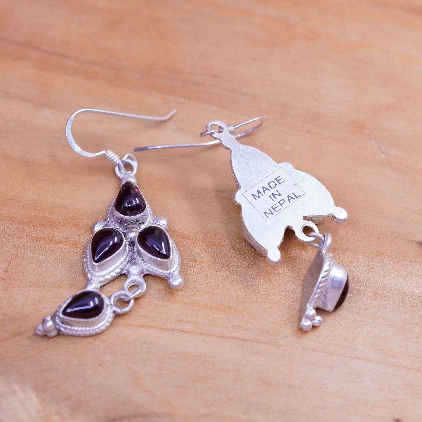 Vintage Nepal Sterling silver handmade earrings with teardrop garnet and cable